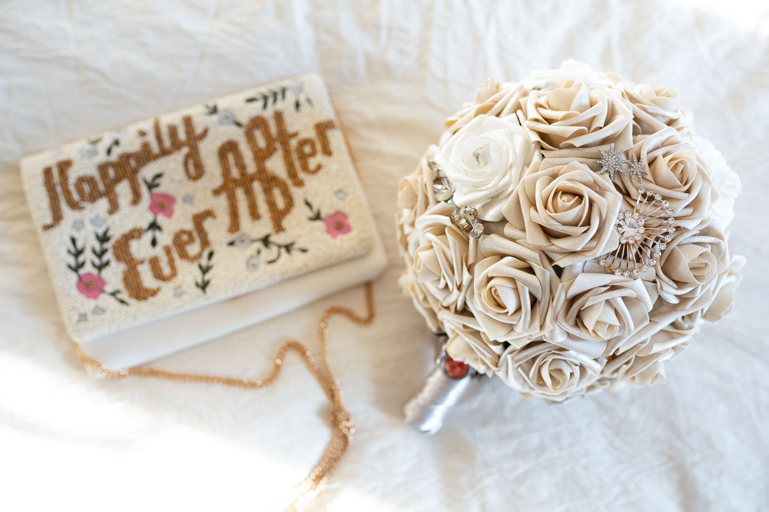 Decorative paper wedding cake topper with elegant rose designs.