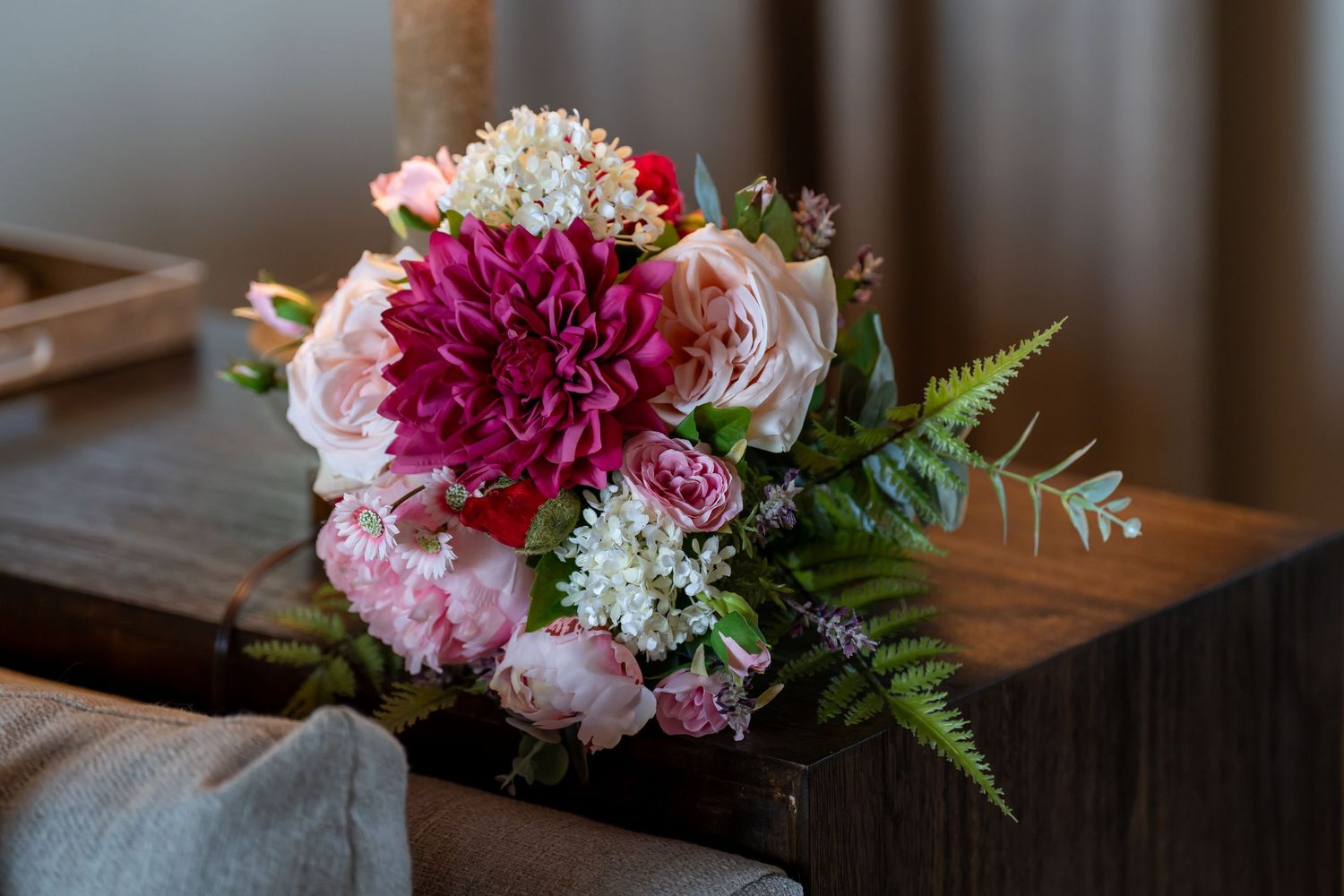 Vibrant floral arrangements featuring pink and magenta blooms with greenery.