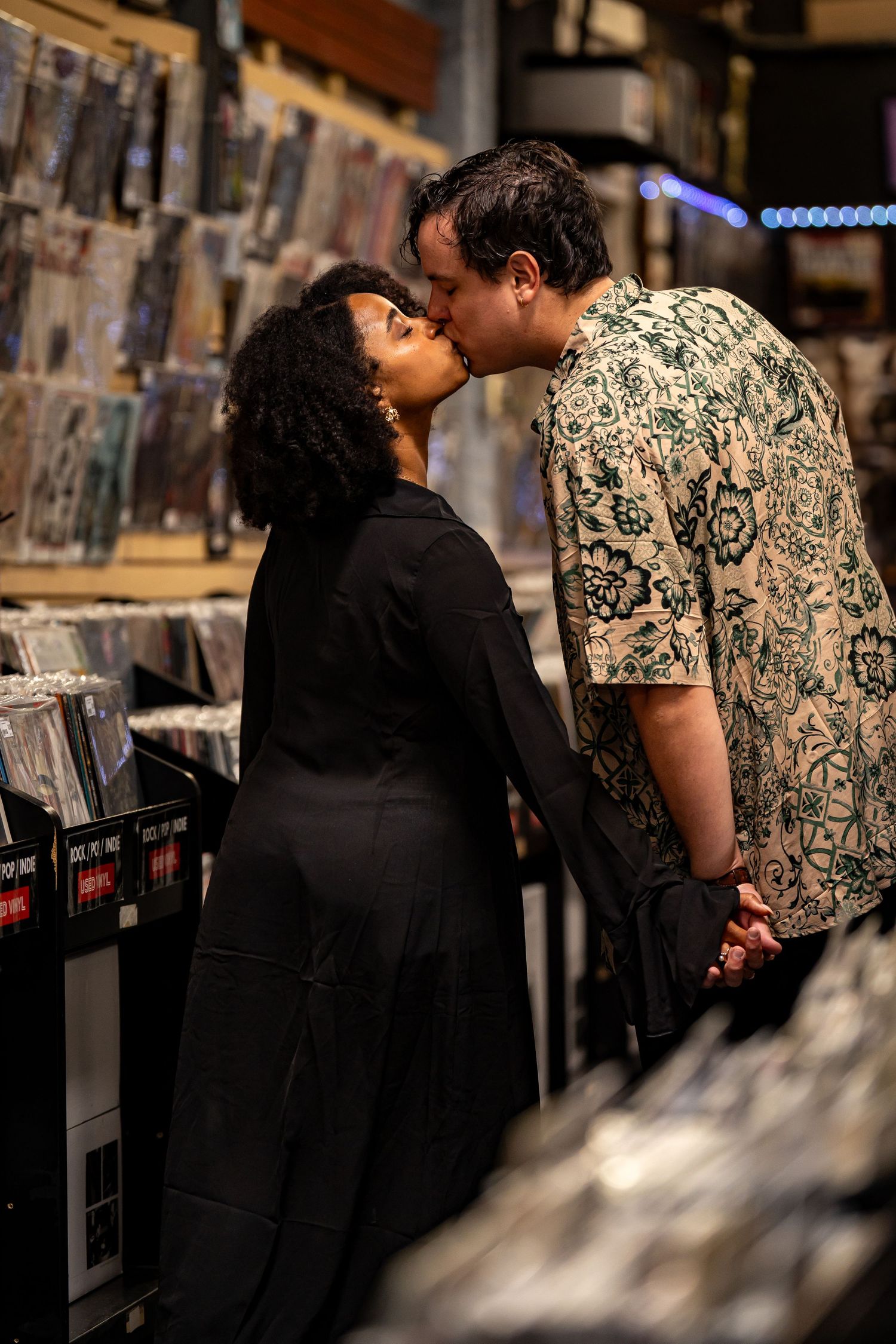 Shoppers looking through music selections at a record store.