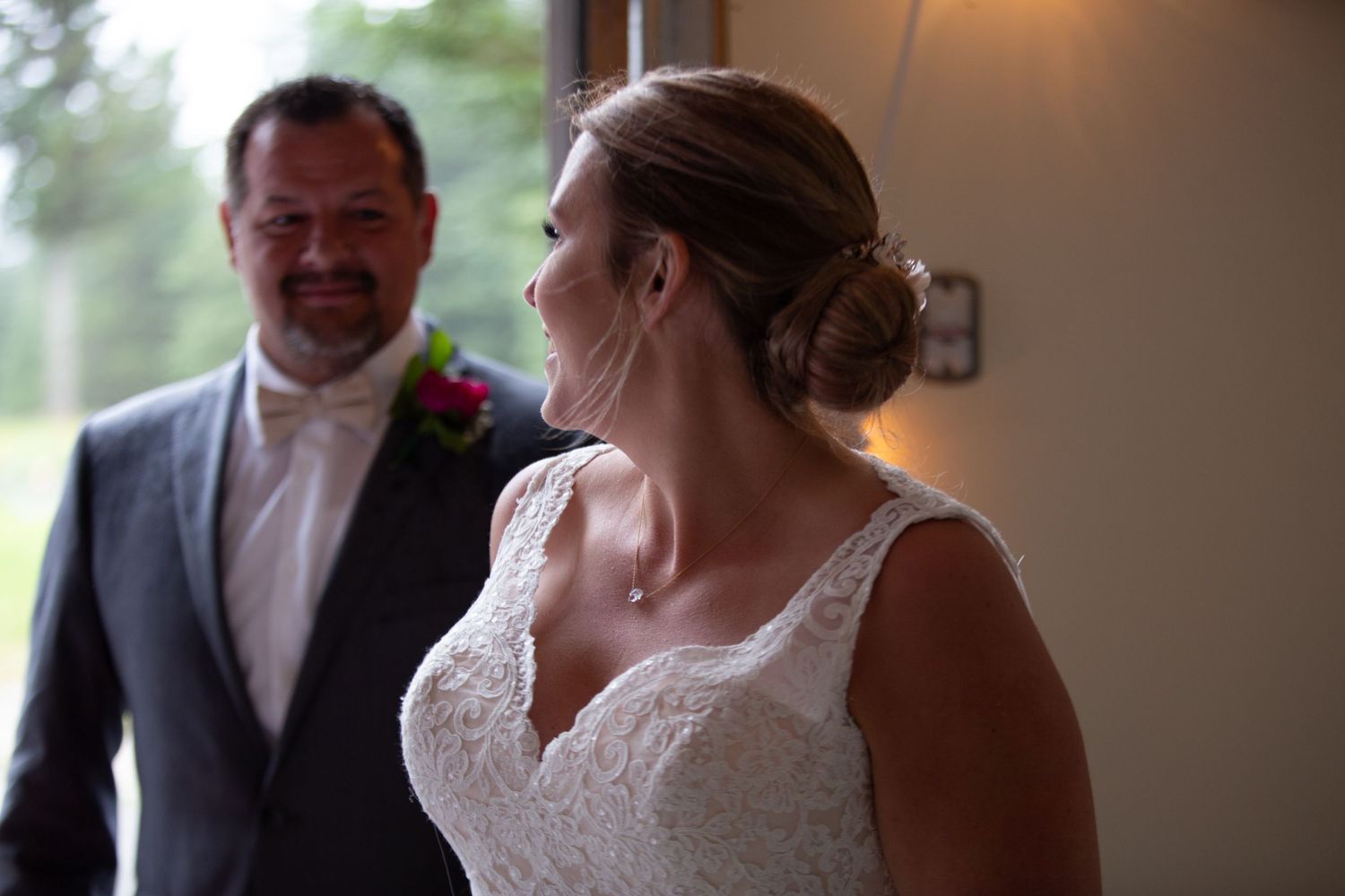 Wedding celebration inside with warm lighting and intimate atmosphere.
