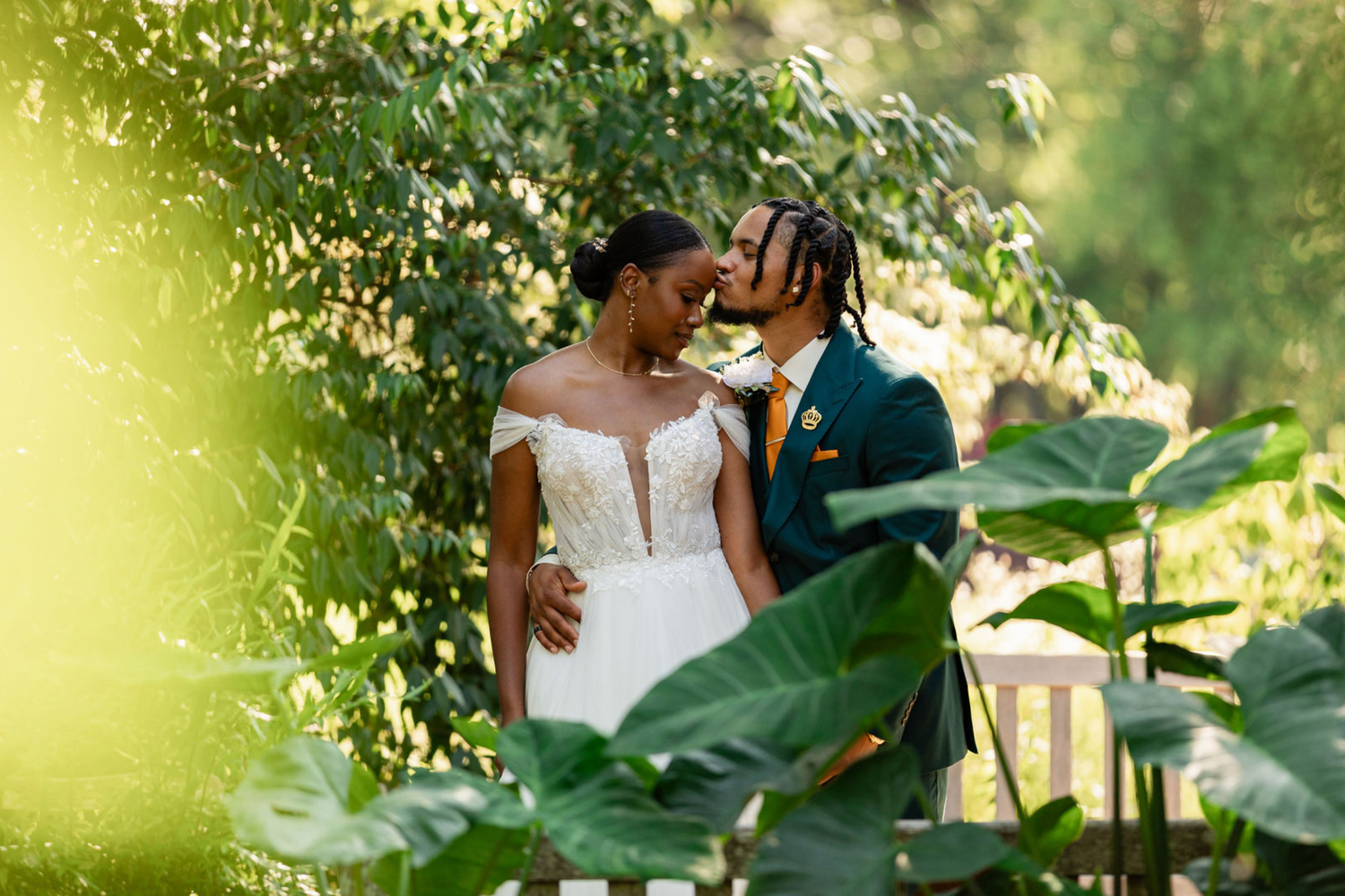 A romantic garden wedding photoshoot with lush greenery and natural lighting.