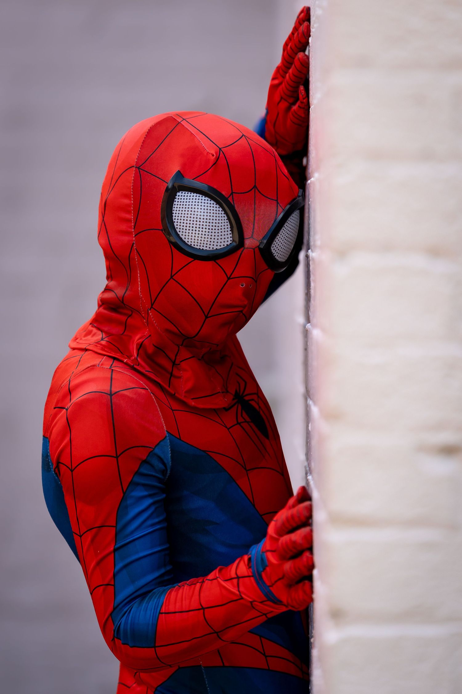 Close-up shots of Spider-Man costume details showing mask and suit textures.