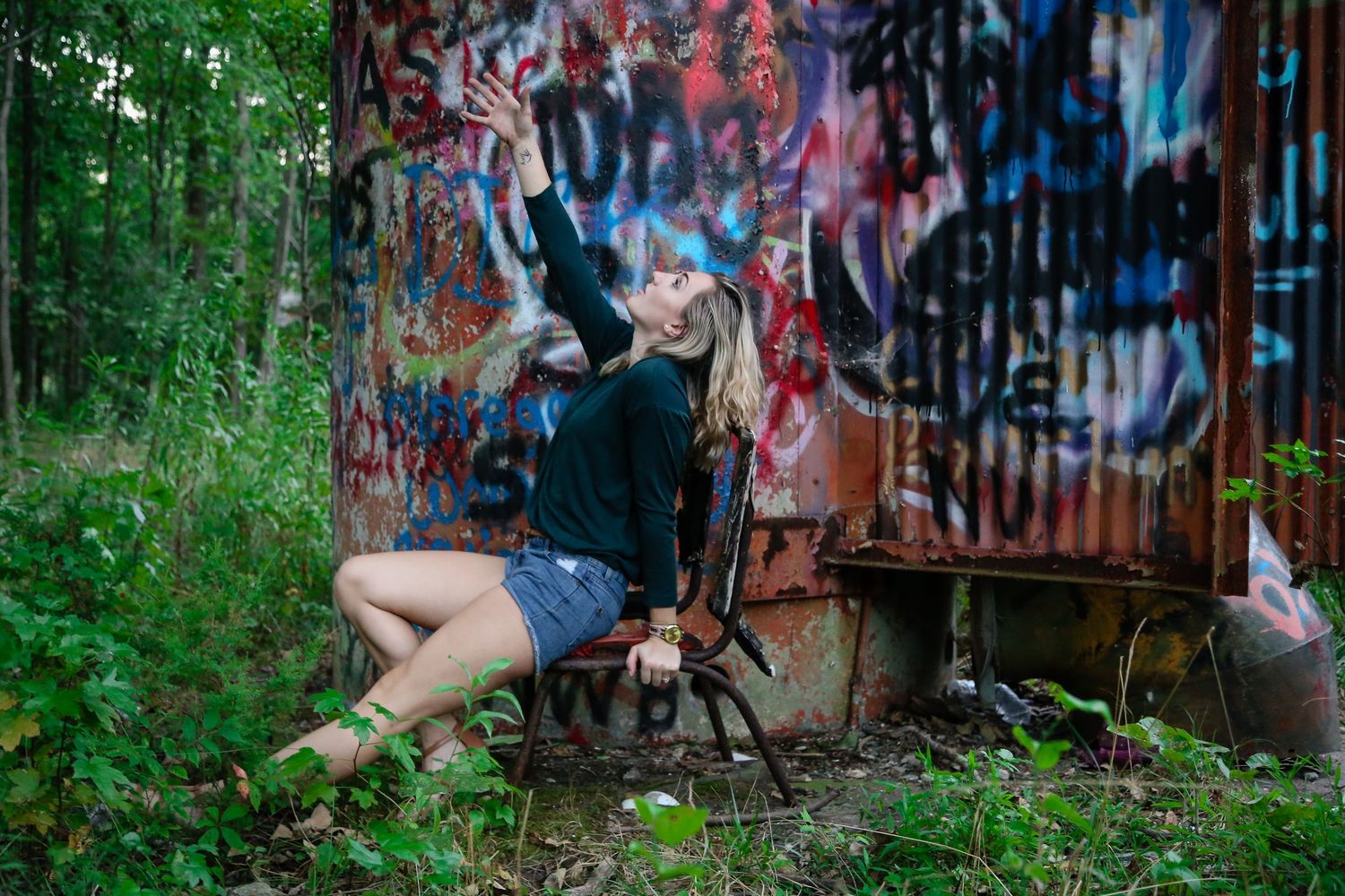 Artistic photo series against a wall covered in colorful street art and graffiti.