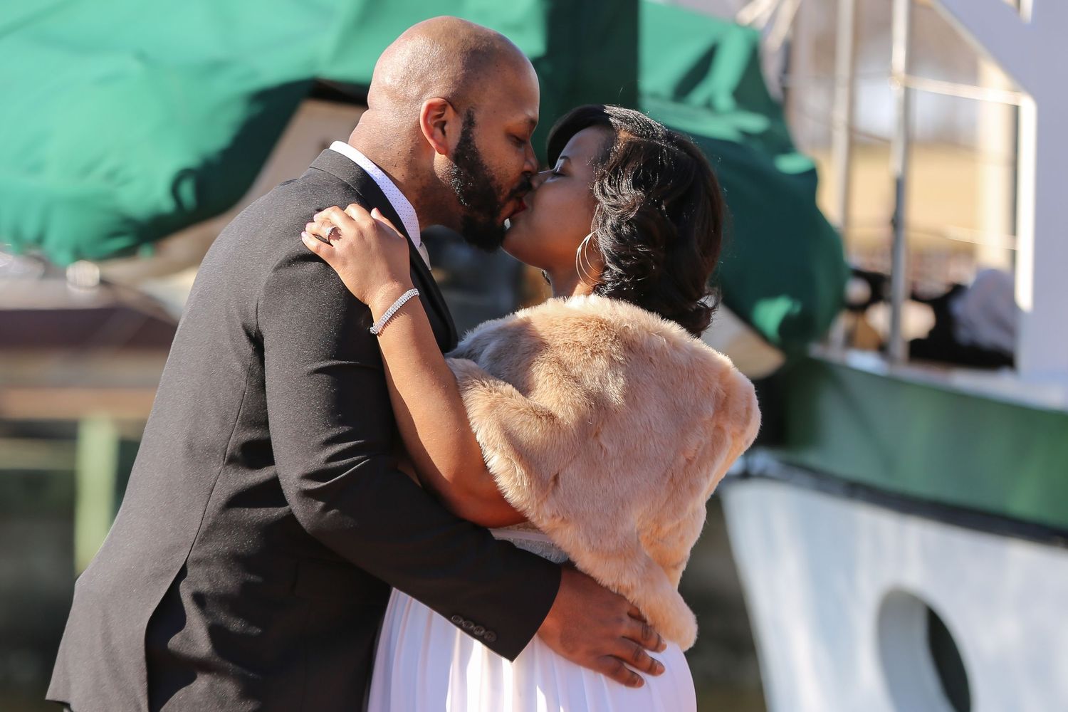 A series of six photos showing a couple embracing and dancing in formal attire at what appears to be a wedding reception.