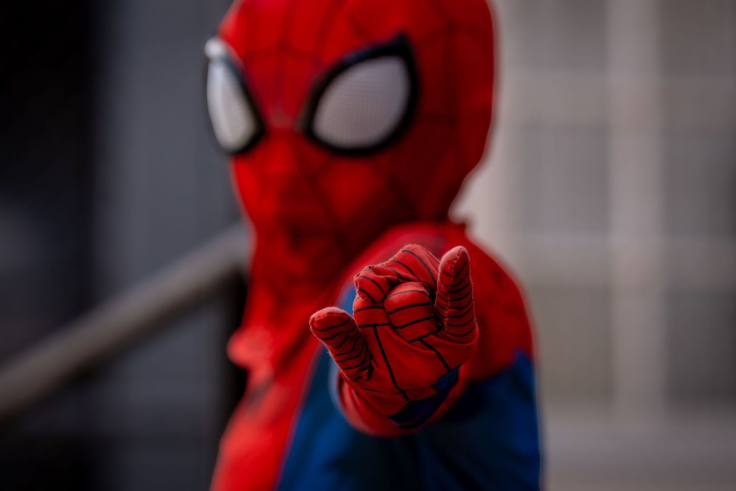 Series of detailed shots focusing on Spider-Man mask and costume features.