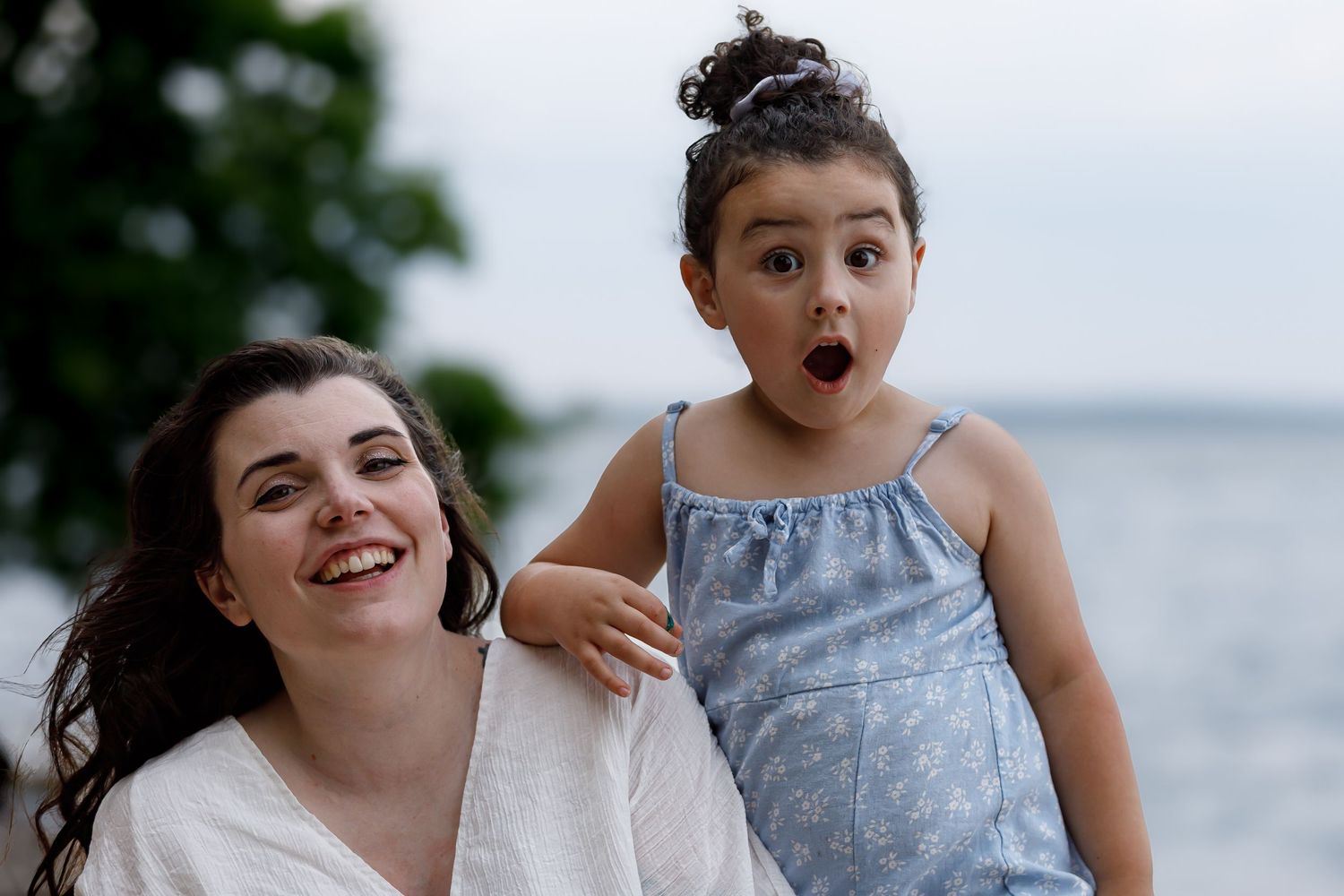Candid moment of laughter shared on the beach.