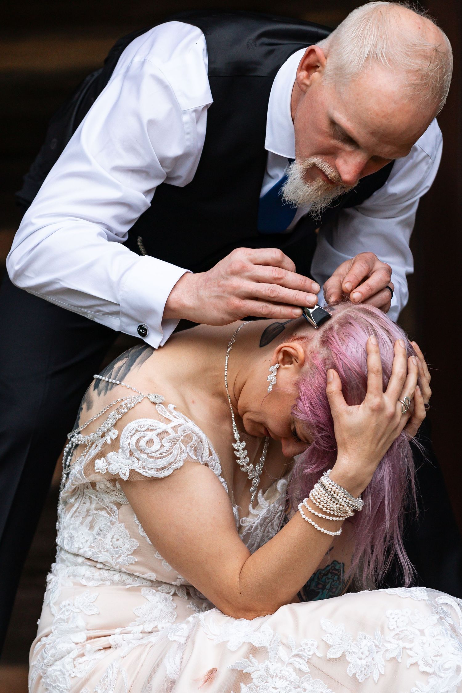 Dramatic wedding portrait series with intimate poses and lace details.