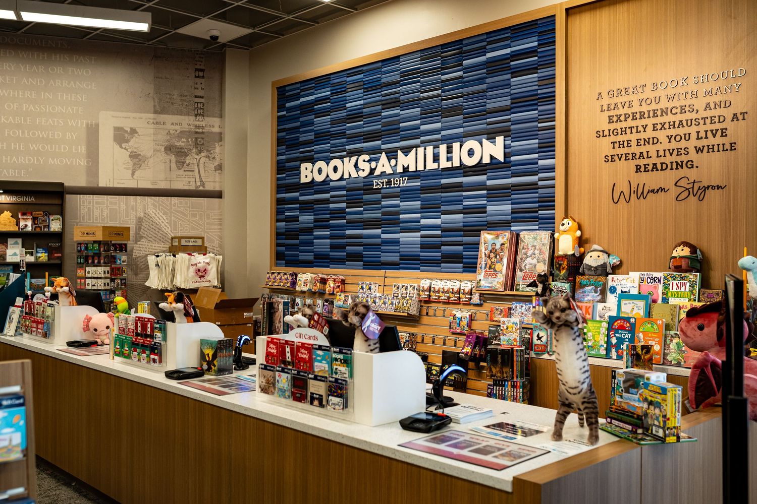 Interior view of Books-A-Million store checkout counter with branded wall display.