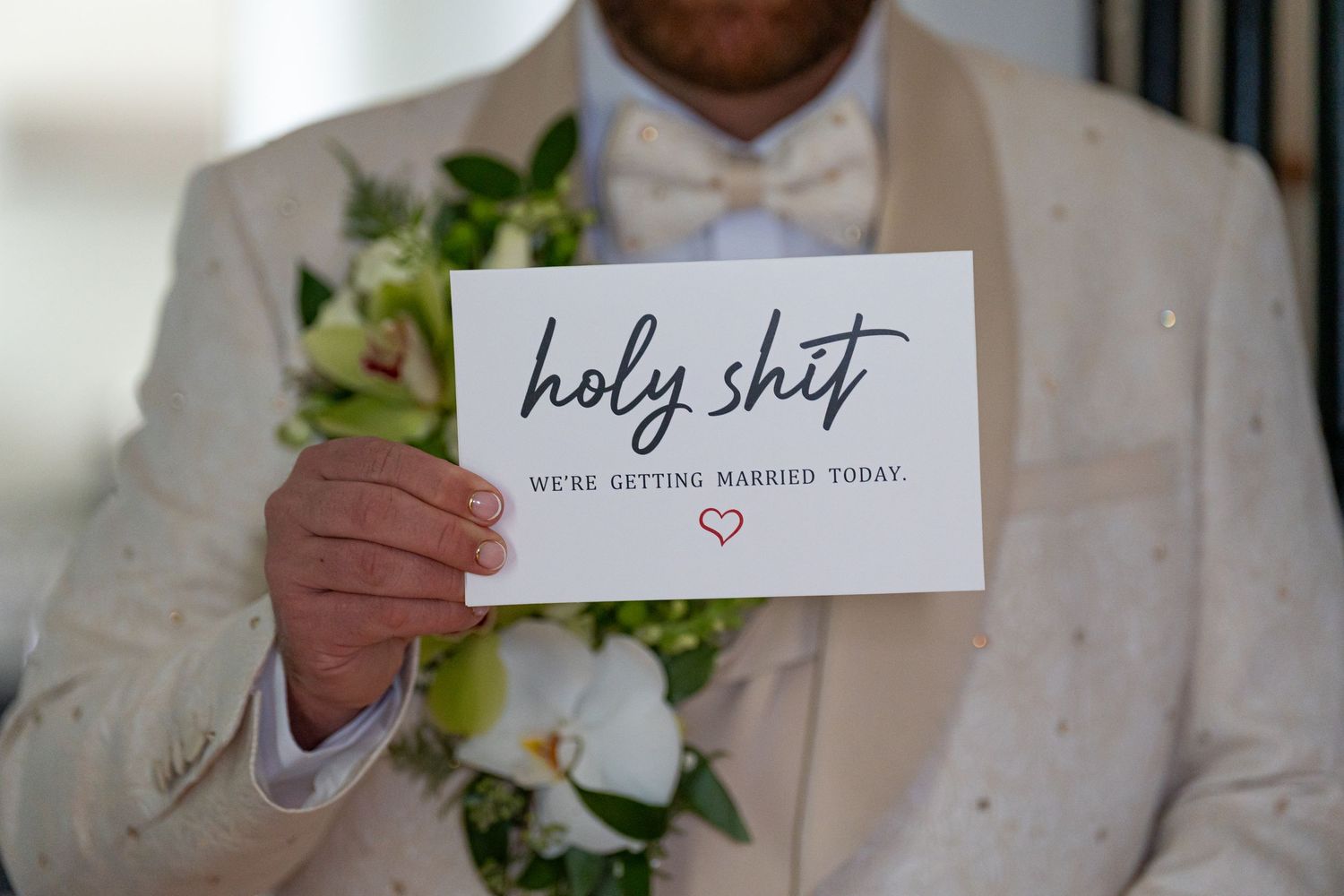 Wedding reception detail shots showing place cards and table settings with elegant calligraphy.
