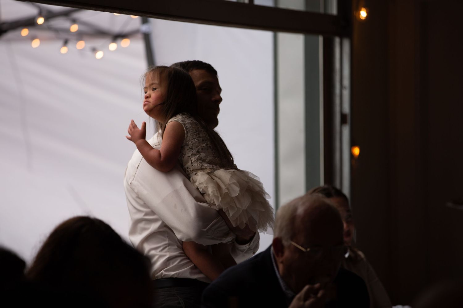Sweet moment during reception as someone is held up during dance.