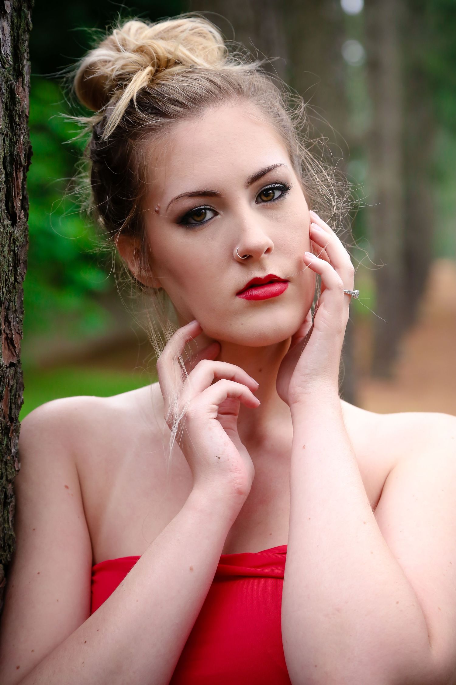 Close-up portrait series with red lipstick and elegant styling in forest setting.