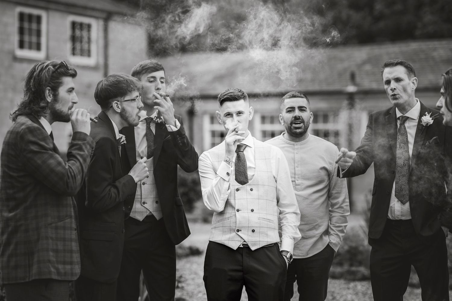 Wedding guests react with joy and excitement during outdoor celebration.