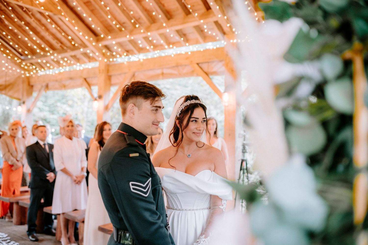 Wedding reception venue decorated with warm string lights creating a romantic atmosphere.