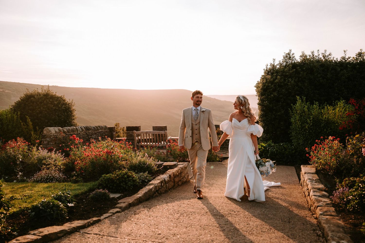 Sunset wedding photography session in a garden with golden hour lighting.