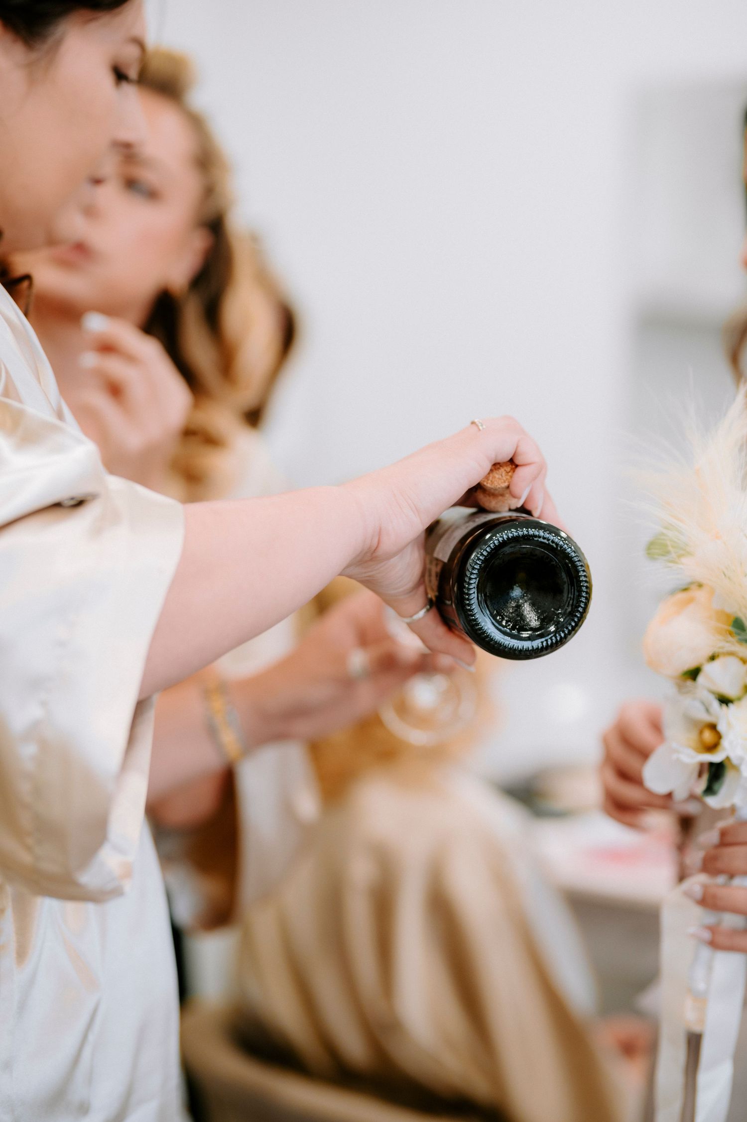 Wedding party members in matching robes preparing for the special day.