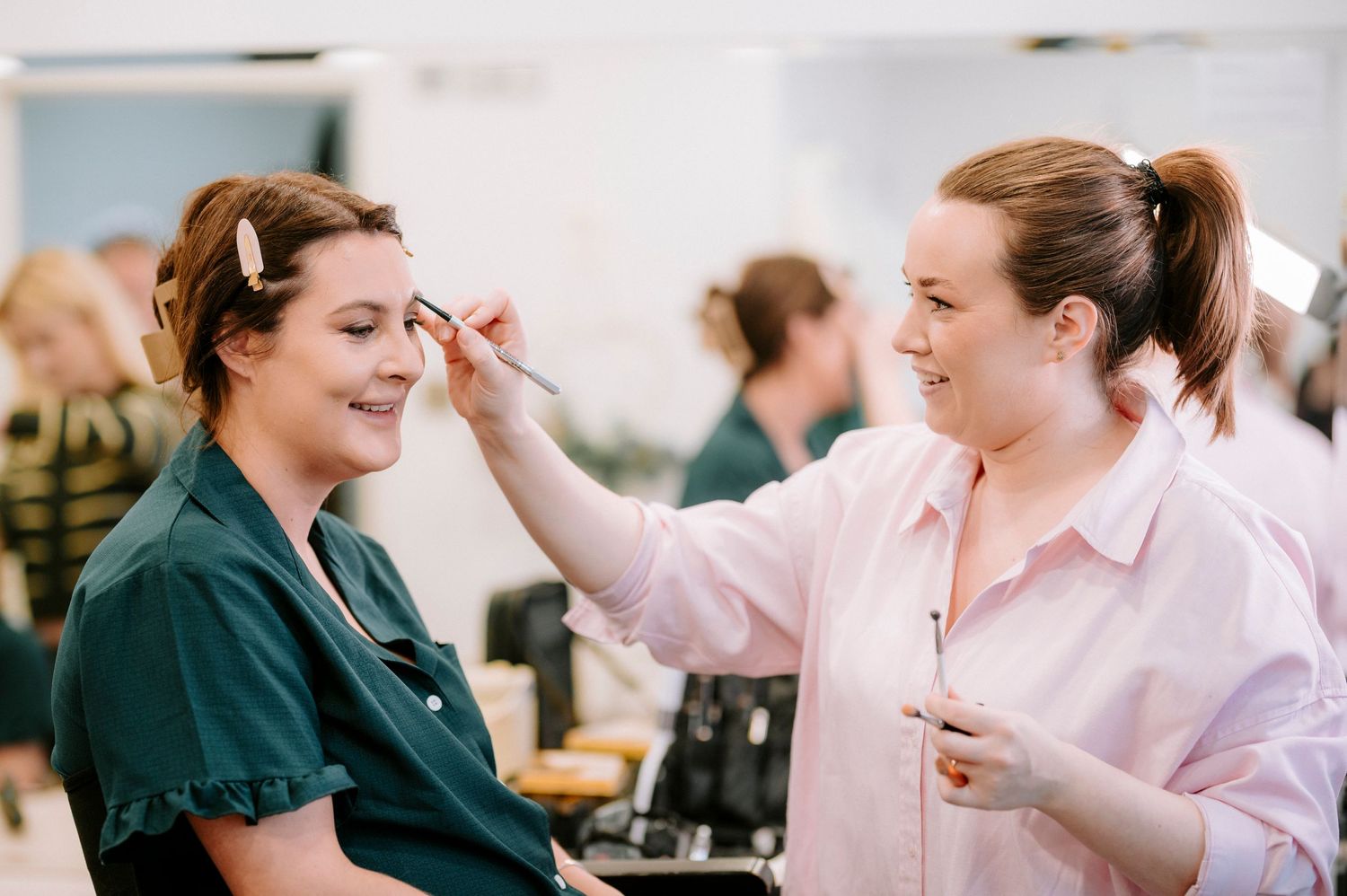 Wedding preparation moments captured in a bright indoor setting.