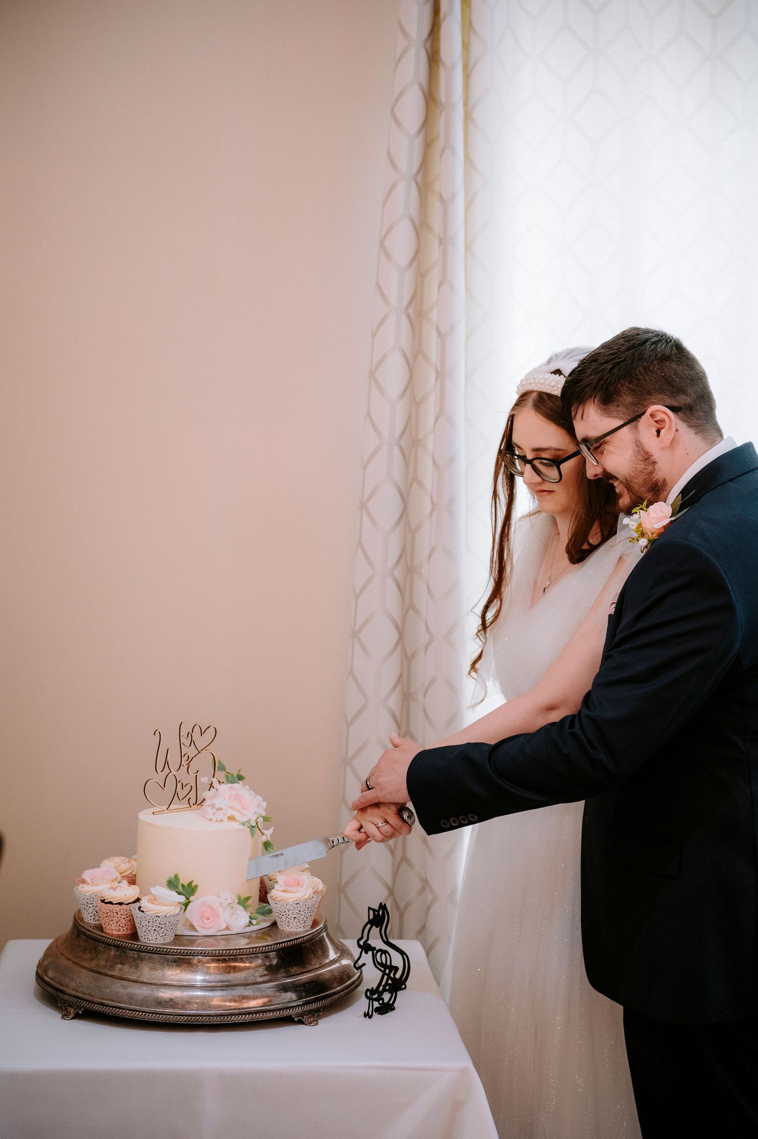 A wedding cake cutting sequence showing a couple sharing their first slice together.