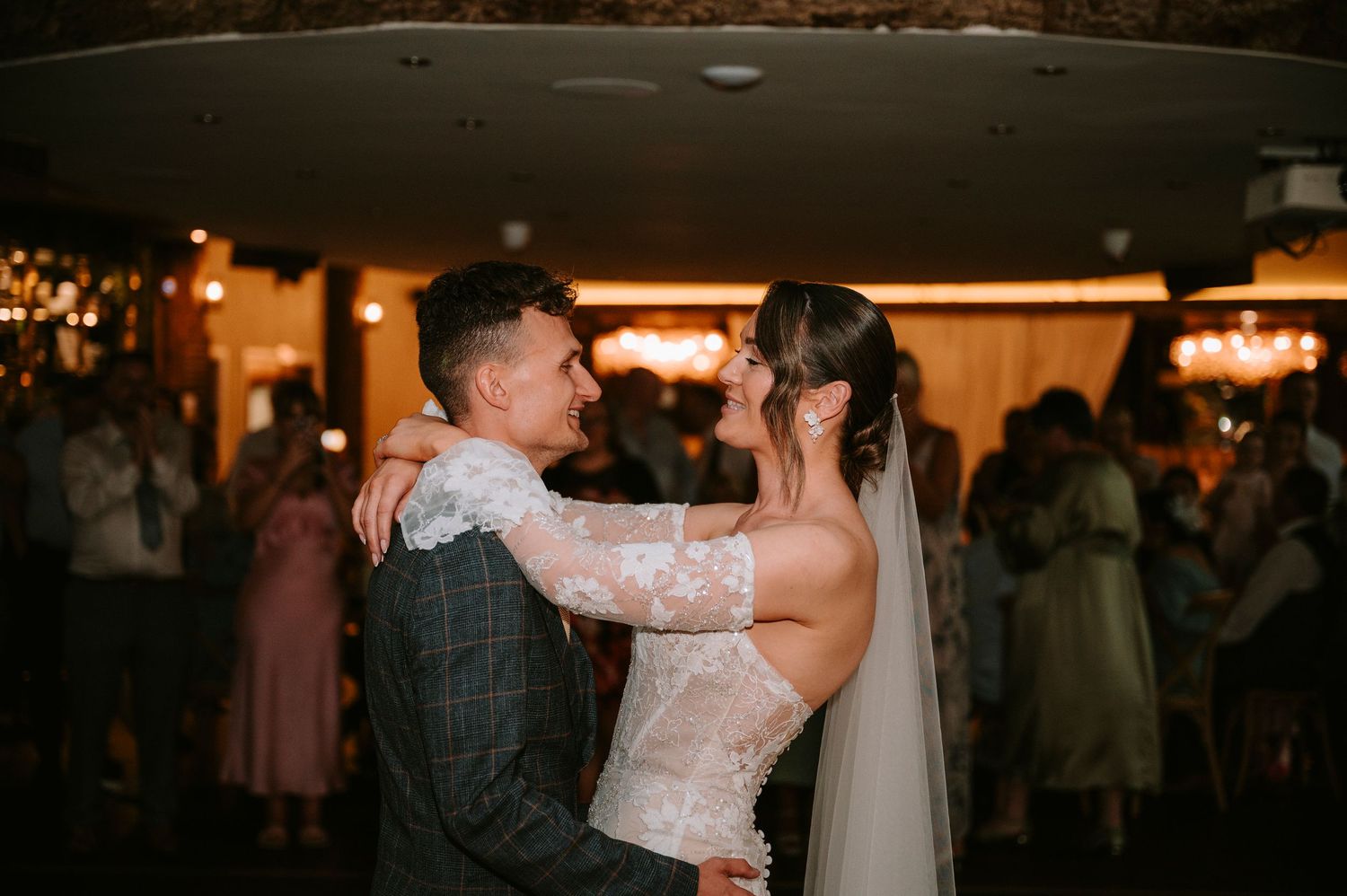 Wedding reception dance floor filled with celebrating guests.