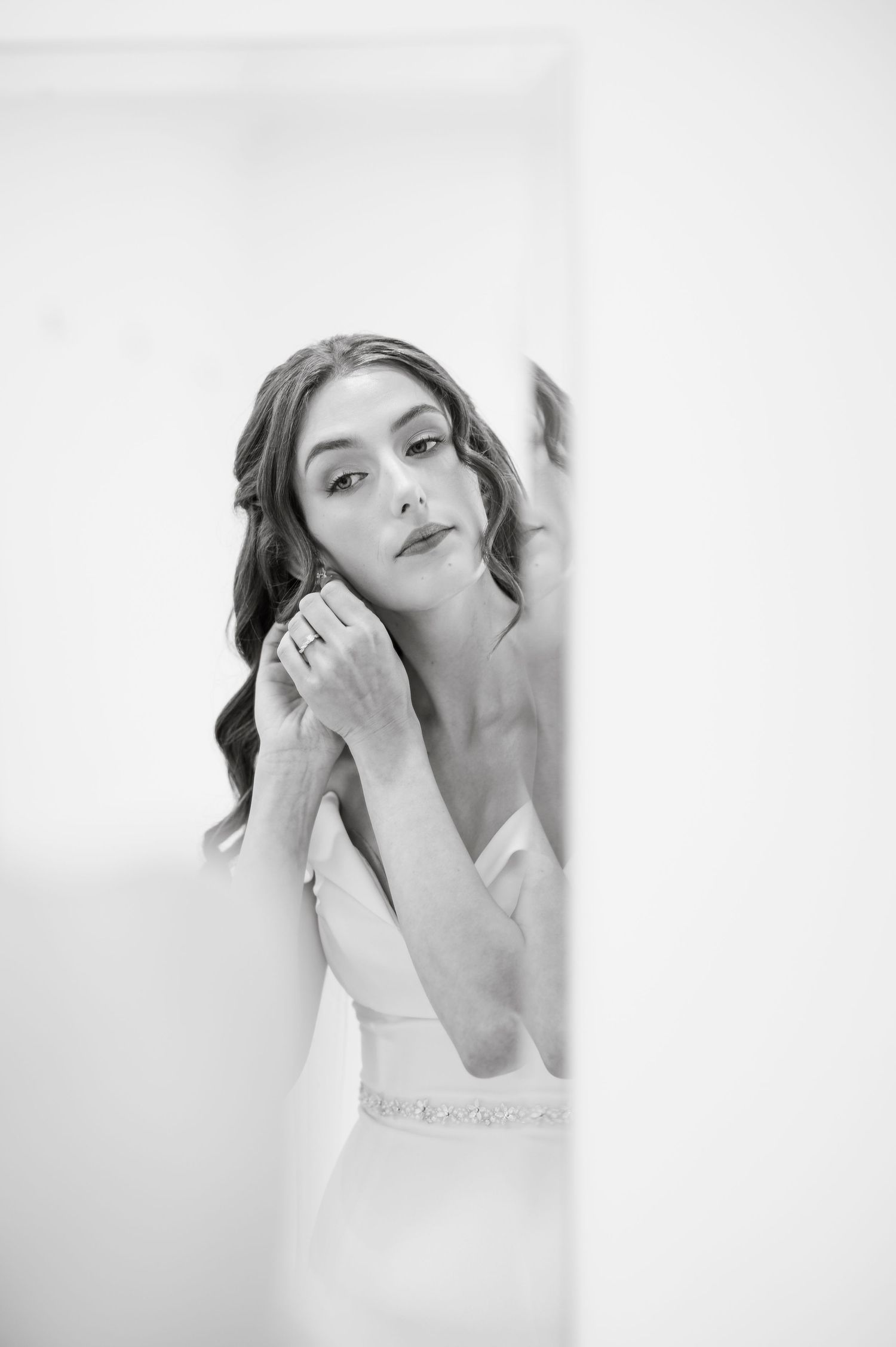 Artistic black and white bridal portrait in natural window light.
