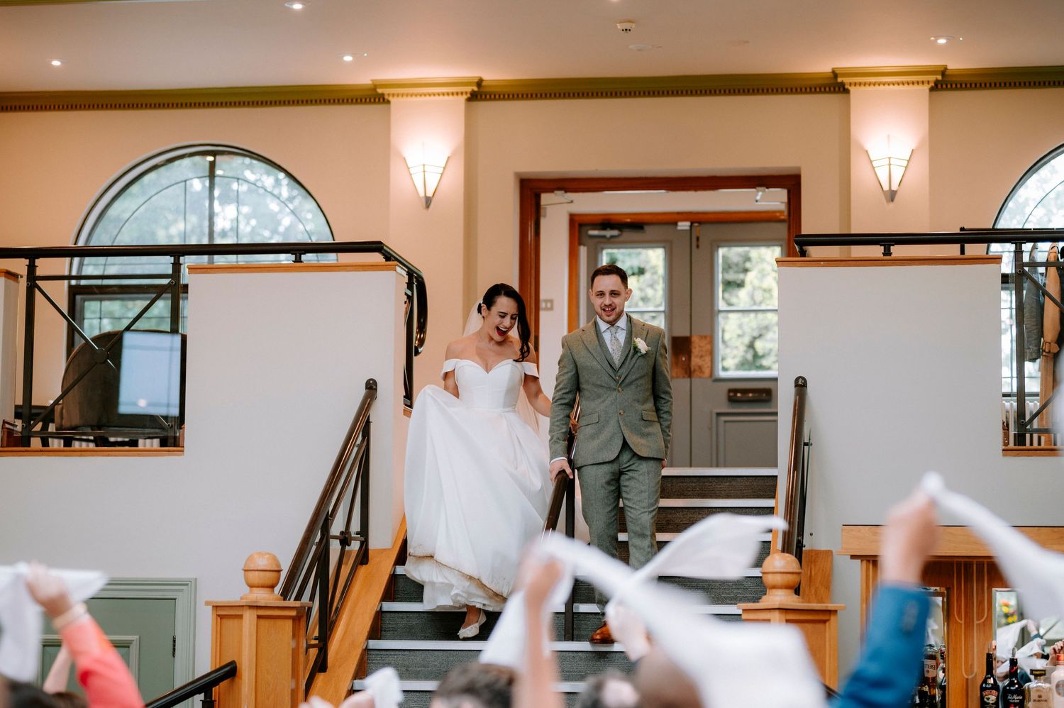 Indoor wedding reception space with modern lighting fixtures and elegant decor.