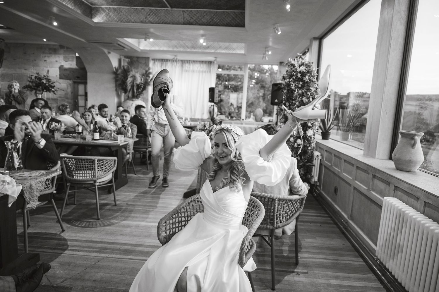 Wedding reception venue with string lights and modern interior decor.