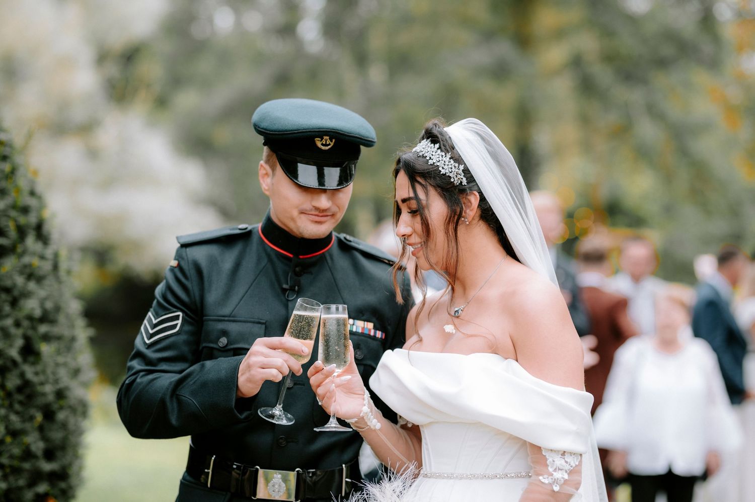 Couple toasting with champagne glasses during their wedding celebration.