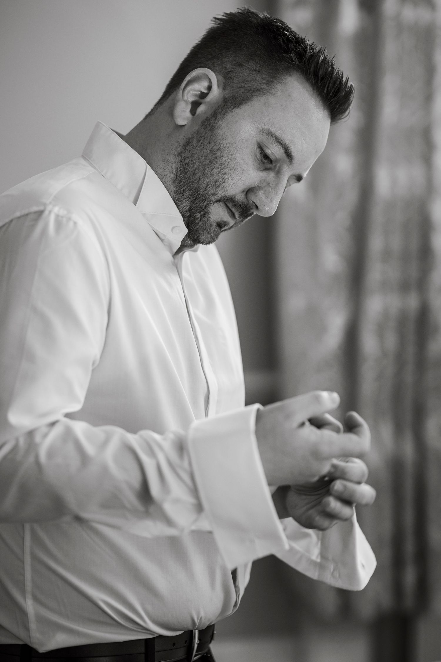 Black and white portraits show candid laughter and joy during pre-wedding moments.