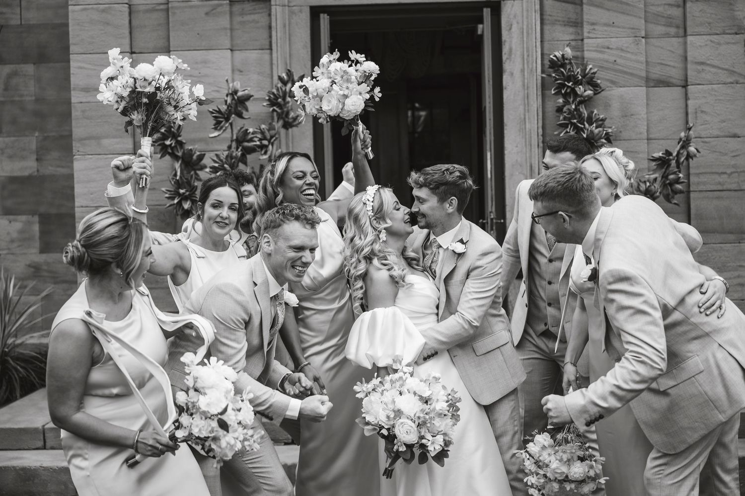 Black and white wedding celebration photos showing joyful moments and candid reactions.