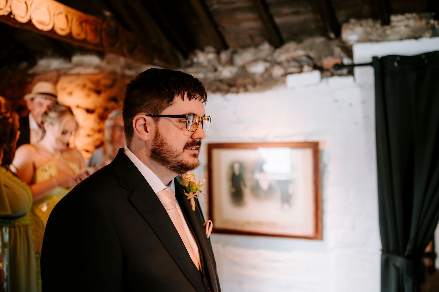 Wedding venue interior with warm lighting and exposed brick walls.