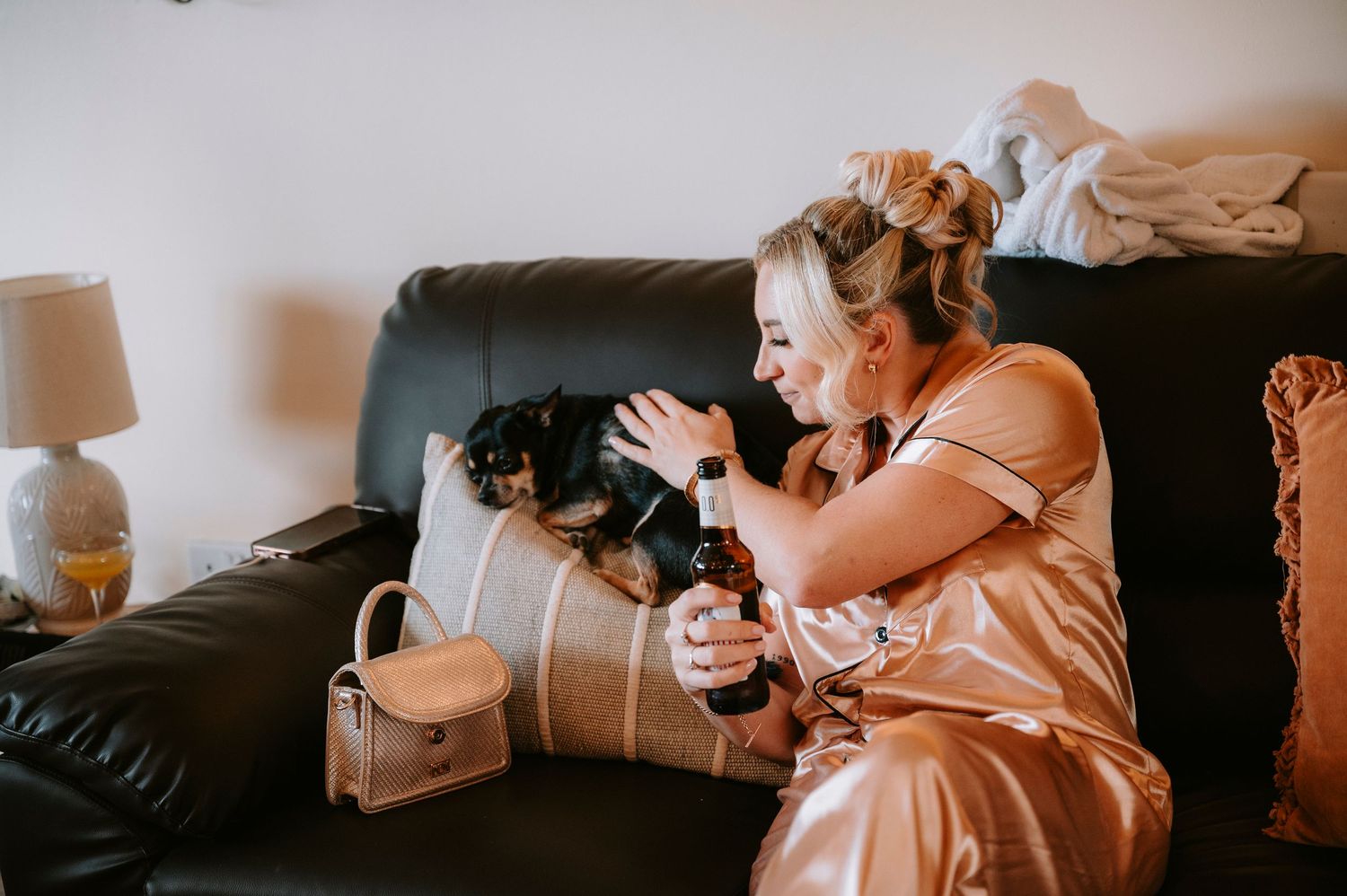 Wedding preparation scene with soft peach tones and morning light.