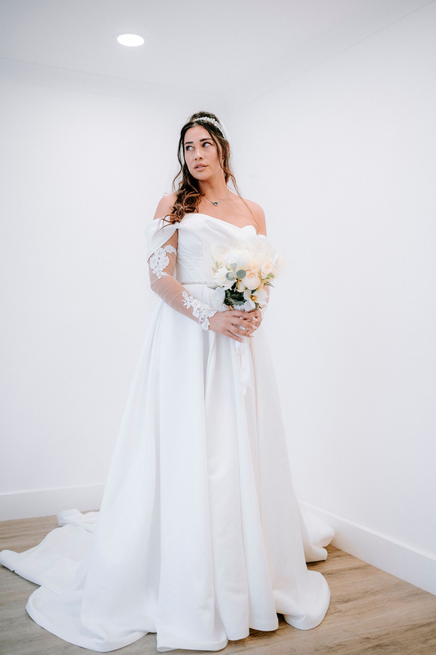Full-length bridal portraits showing off a stunning white ballgown wedding dress.