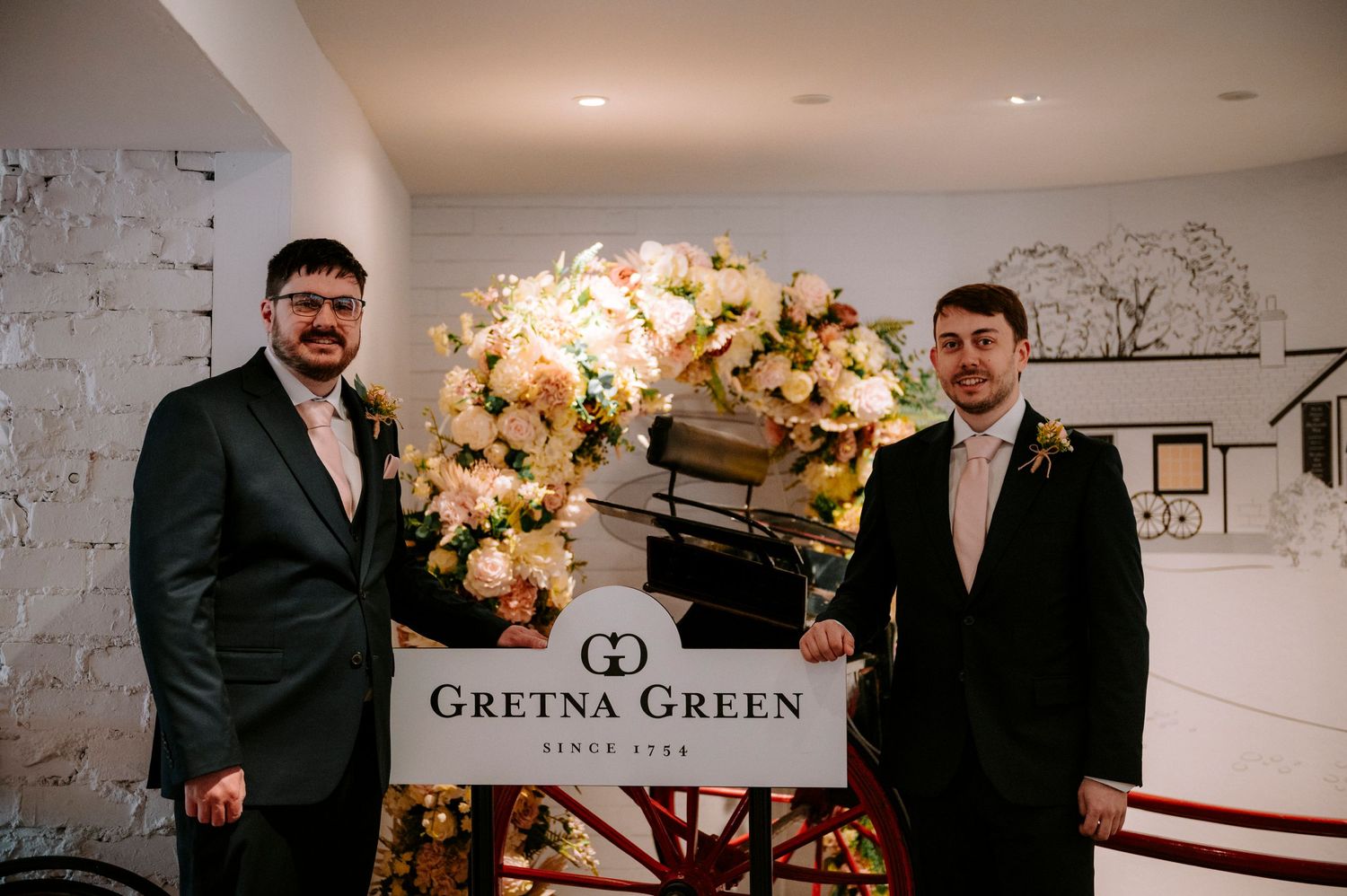 Interior of Gretna Green wedding venue with elegant floral decorations.