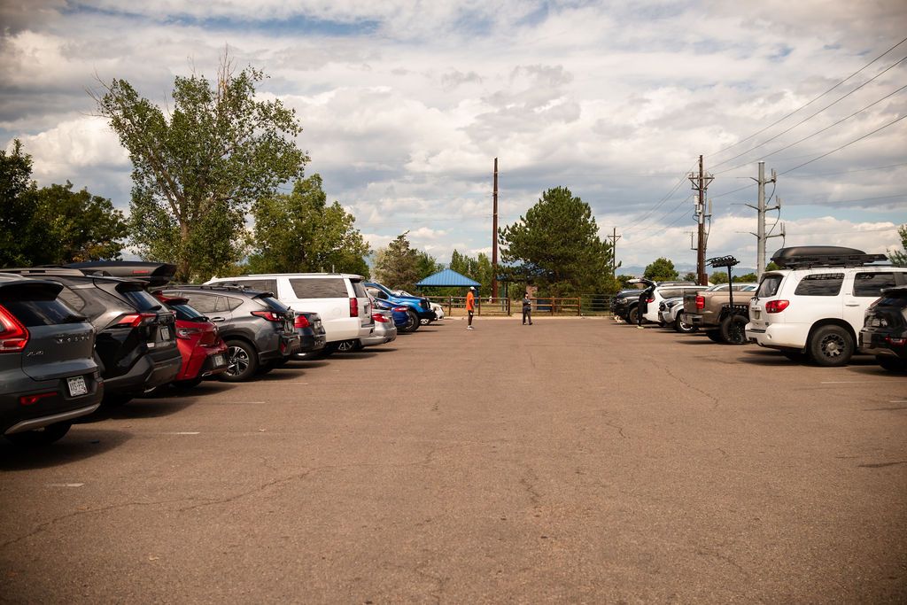 A view of the main entrance gravel parking lot at Golden Ponds Nature Area for family photography sessions in Longmont, CO.