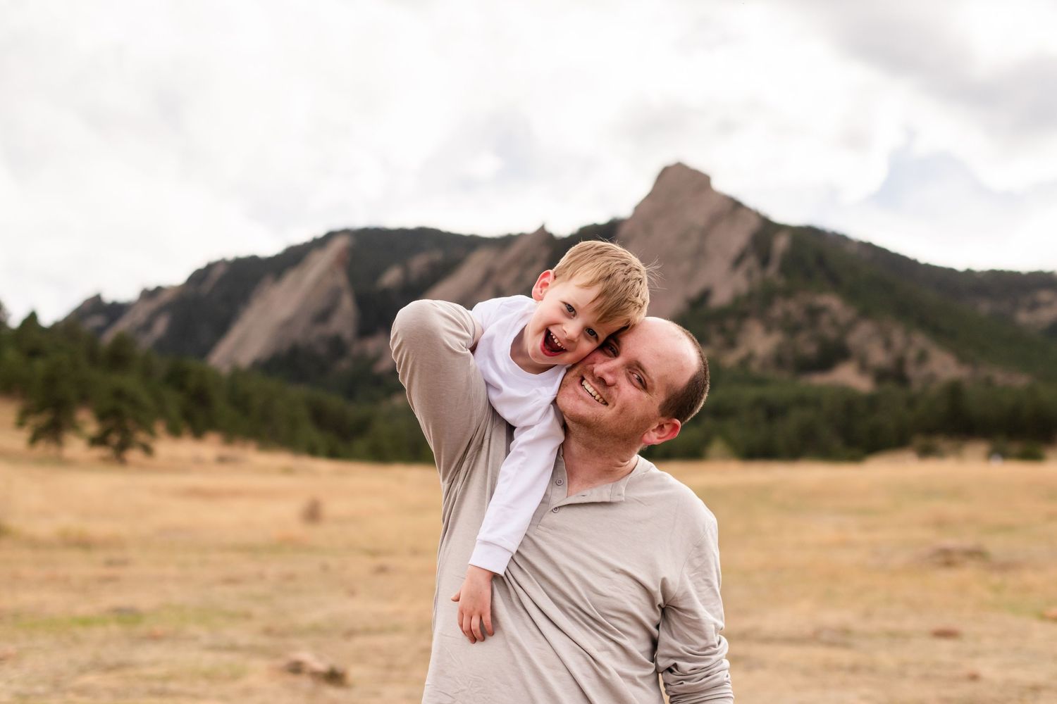 Photography of a father and son playful idea family, True to Life color at Chautauqua Park, Boulder, CO, photography by Angelice Caballer