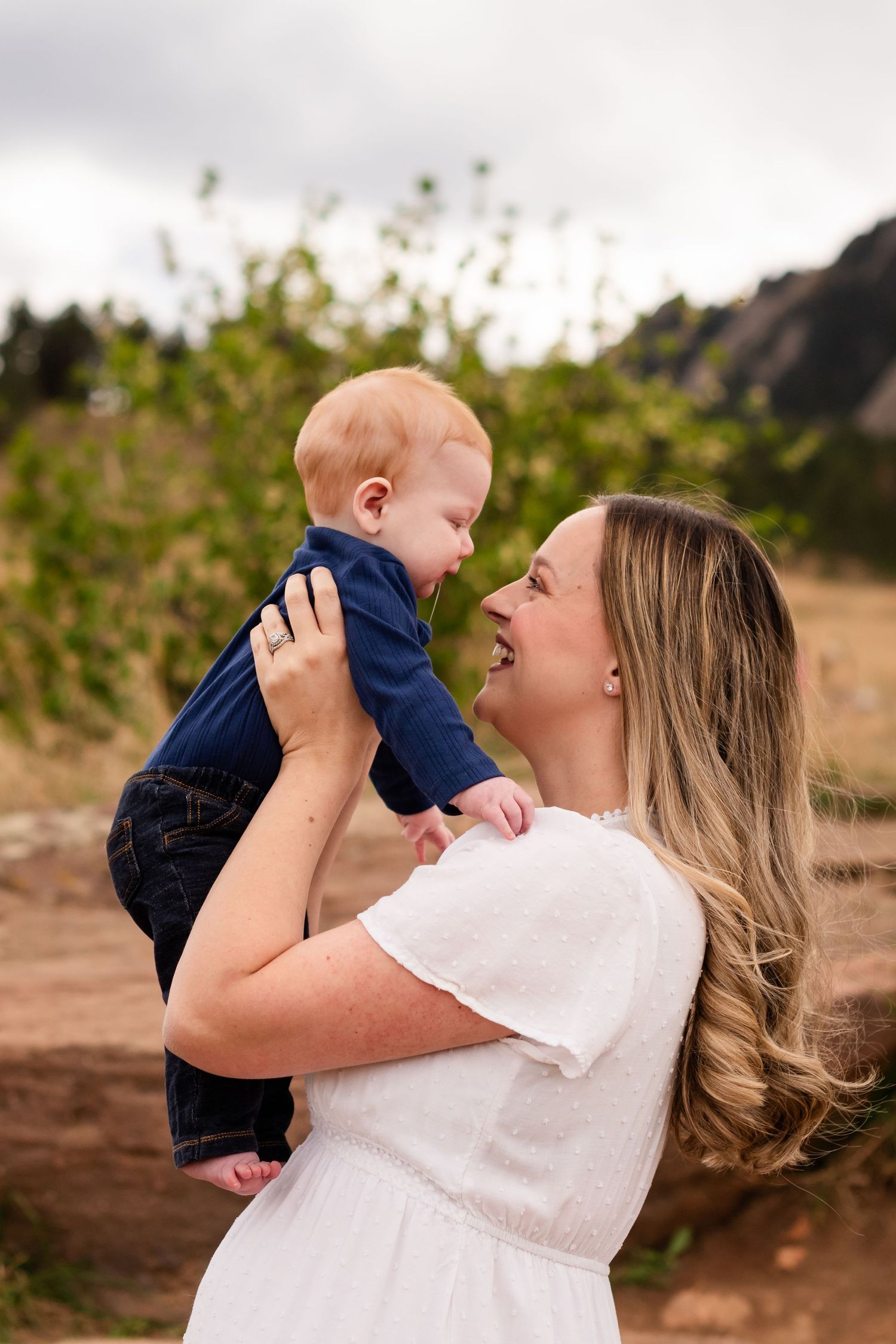 Photography of a baby and mom playing family photography True to Life color at Chautauqua Park, Boulder, CO photography by Angelice Caballer