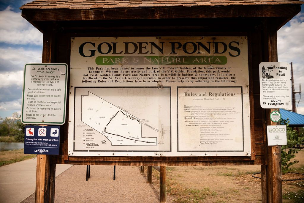 The updated park information display billboard and trail map near the main entrance structure at Golden Ponds.