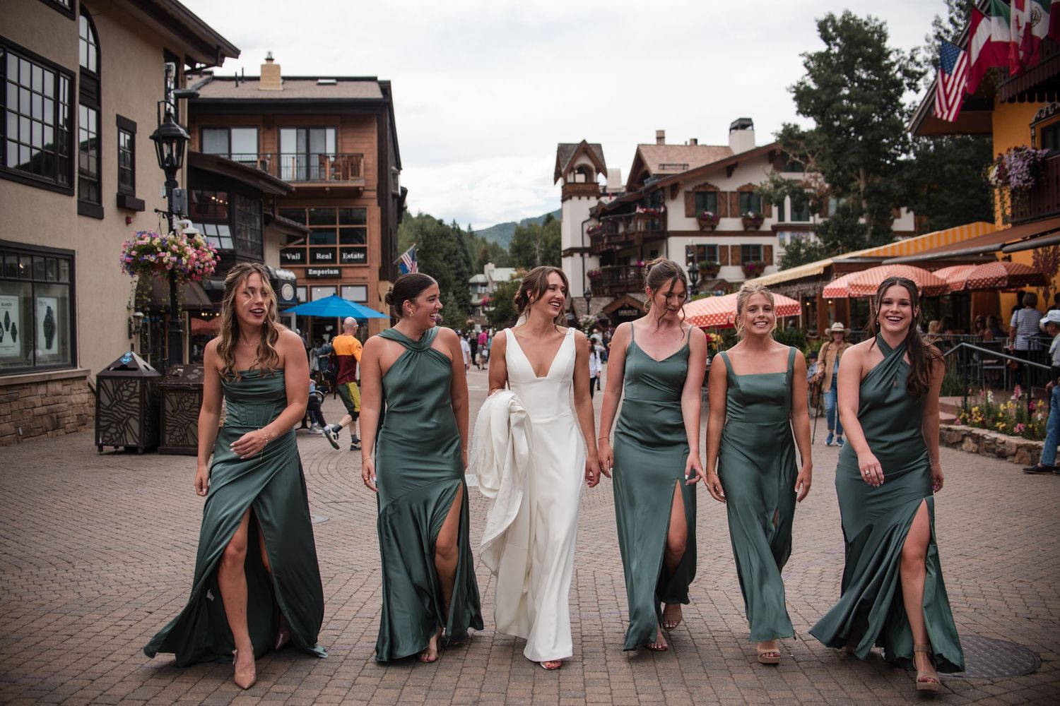 Bides maids portraitswalking in Vail Village, CO, Mountain wedding. True-to-life, bright, and airy  photographer Angelice Cababller