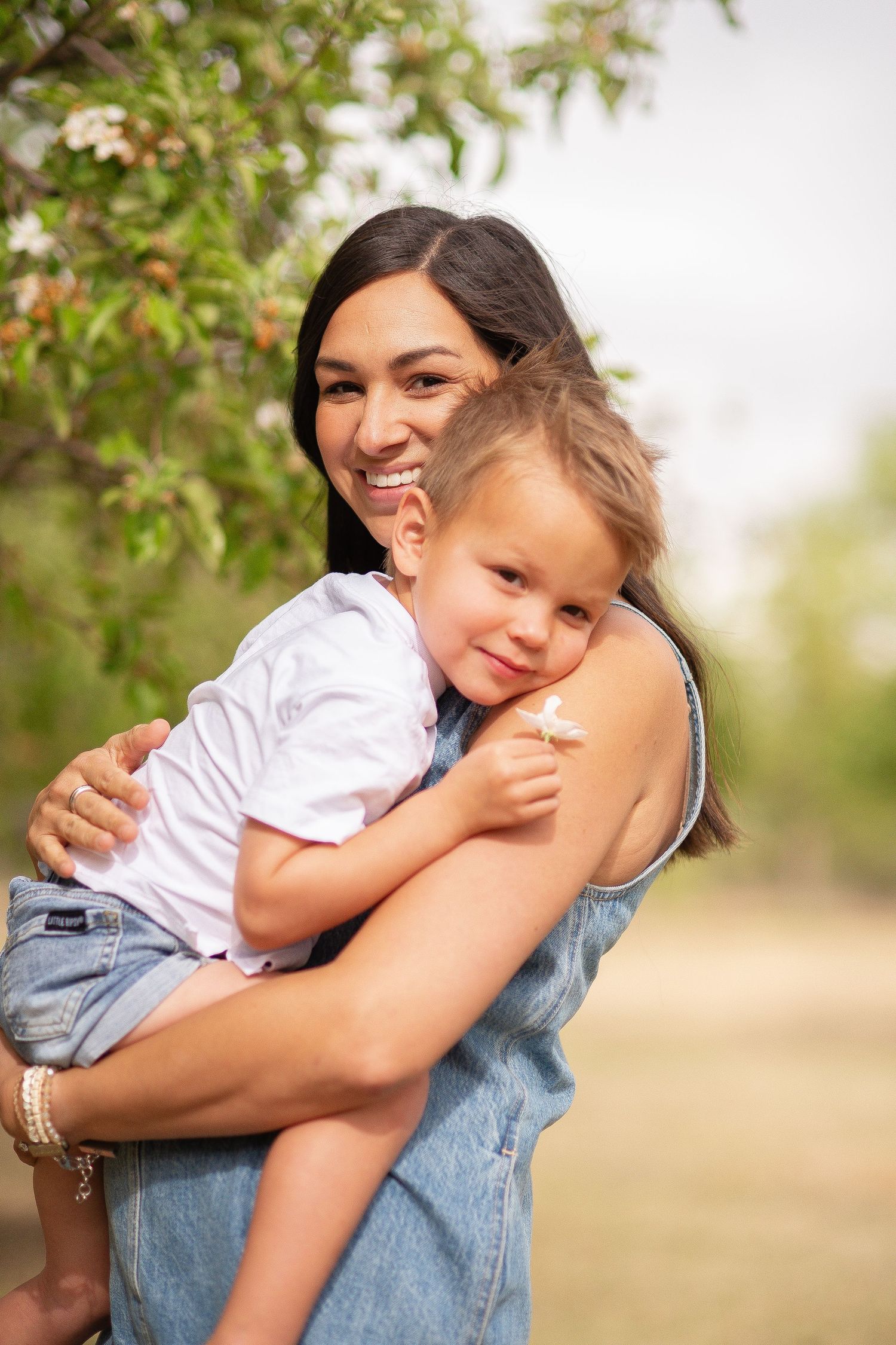 Family photography, Mother and son pose idea, true to life colors, spring  apple orchard at Rogers Grove, Longmont by Angelice Caballer