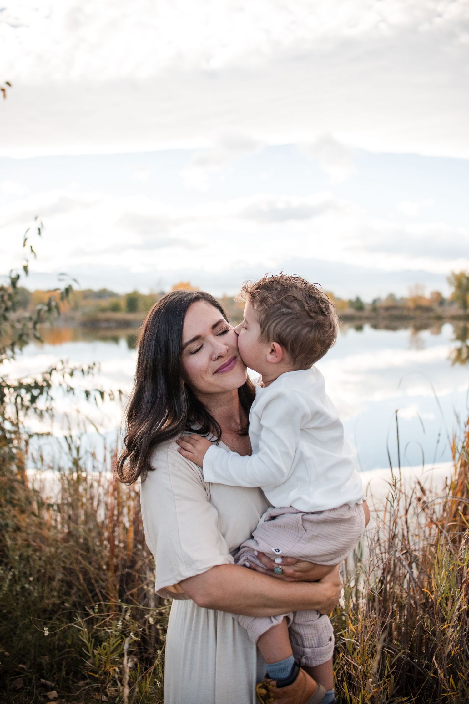 Longmont-CO-family-photographer-outdoor-session, Real candid moments with mother and child, Golden Ponds