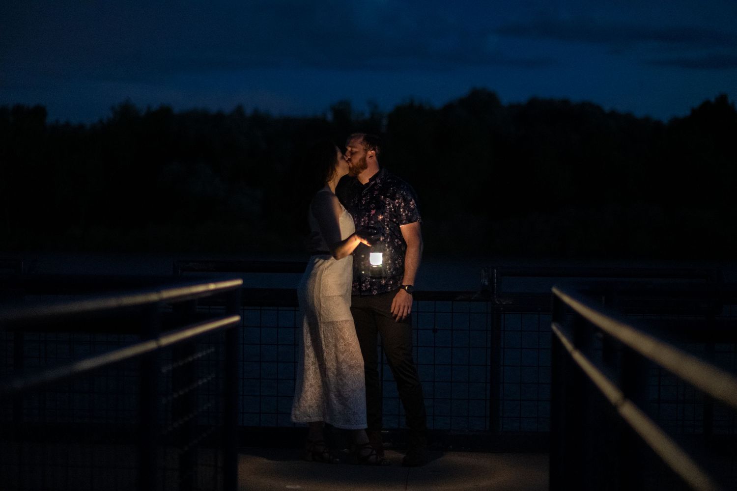 Romantic Engagement couple holding lantern  photos, artistic blue hour photography location, the Golden Ponds, Longmont, at Golden Hour