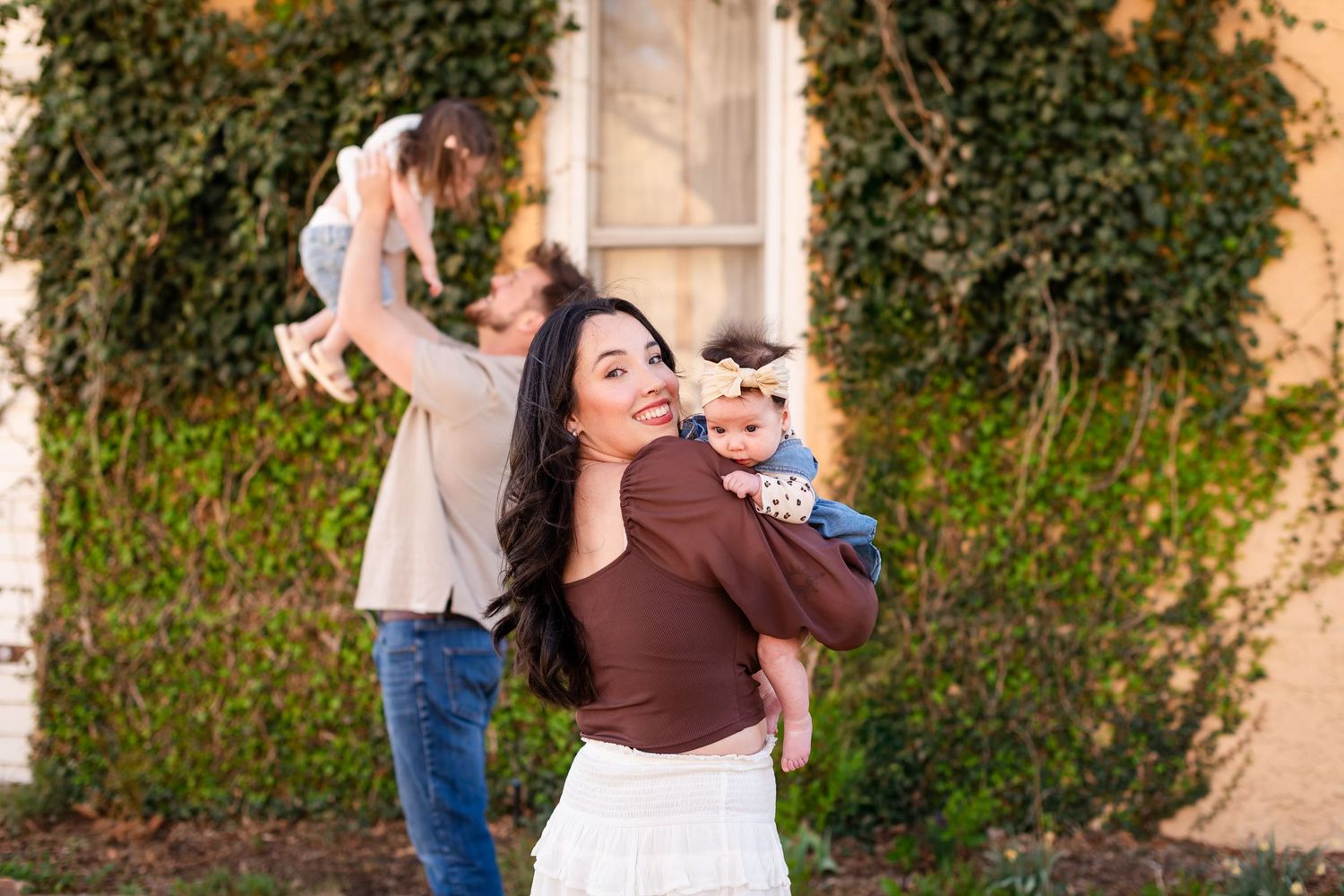 Family photography, playful movement, child fun pose, true to life colors,  Sandstone Ranch, Longmont by Angelice Caballer