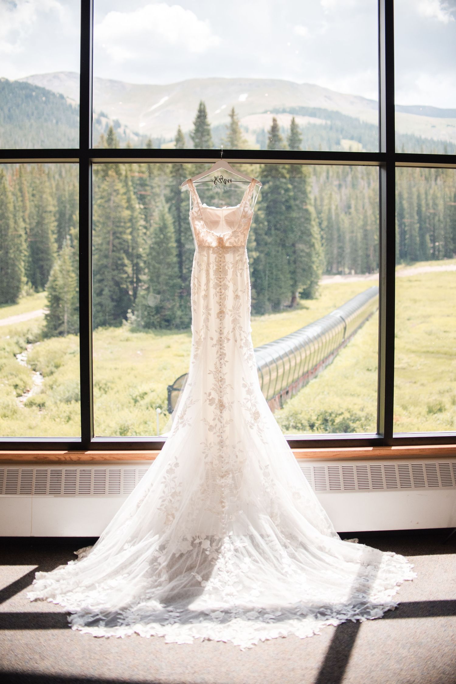Inspiration photo of a wedding dress hanging at Loveland Ski Resort, perfect for ski resort weddings.