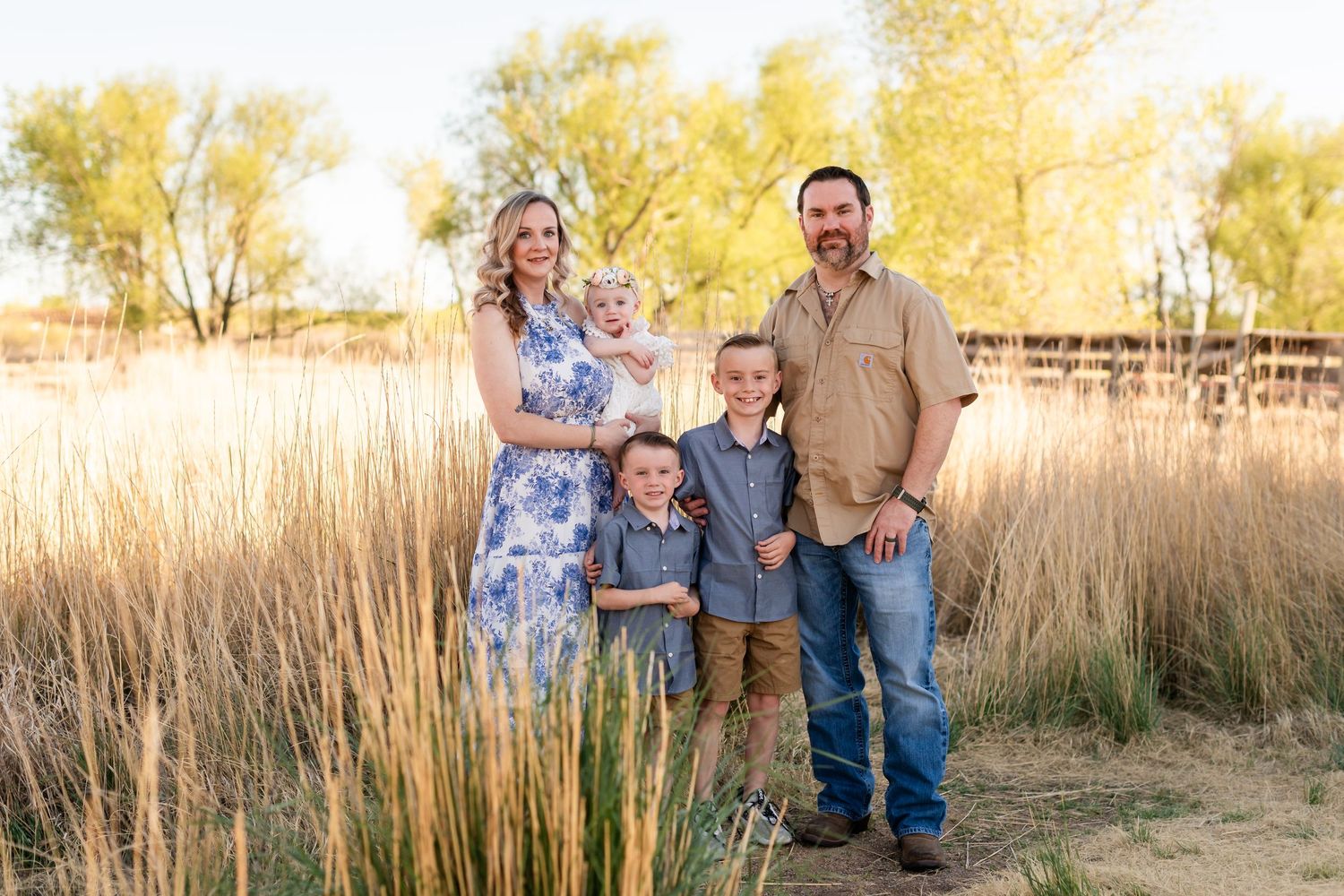 Family photography,  family pose with rustic barn, Golden hour dreamy, true to life colors,  Sandstone Ranch, Longmont by Angelice Caballer