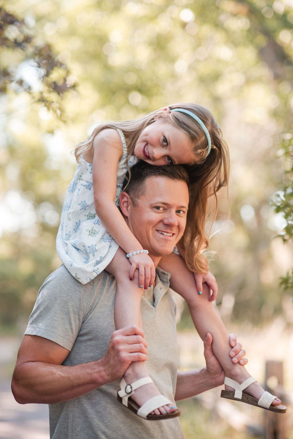 Father and daughter playful autumn mini session at Golden Ponds Nature Area in Longmont