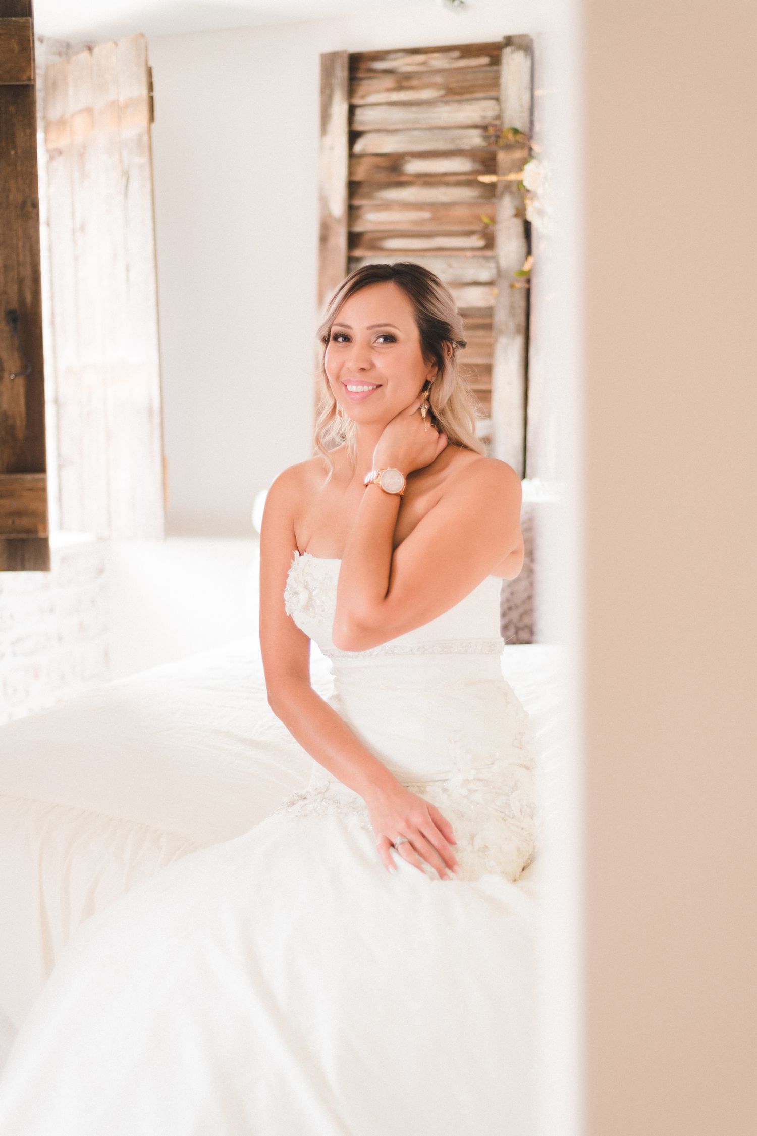 Candid moment of the bride sitting in the bridal suite at Still Waters Ranch, Colorado.