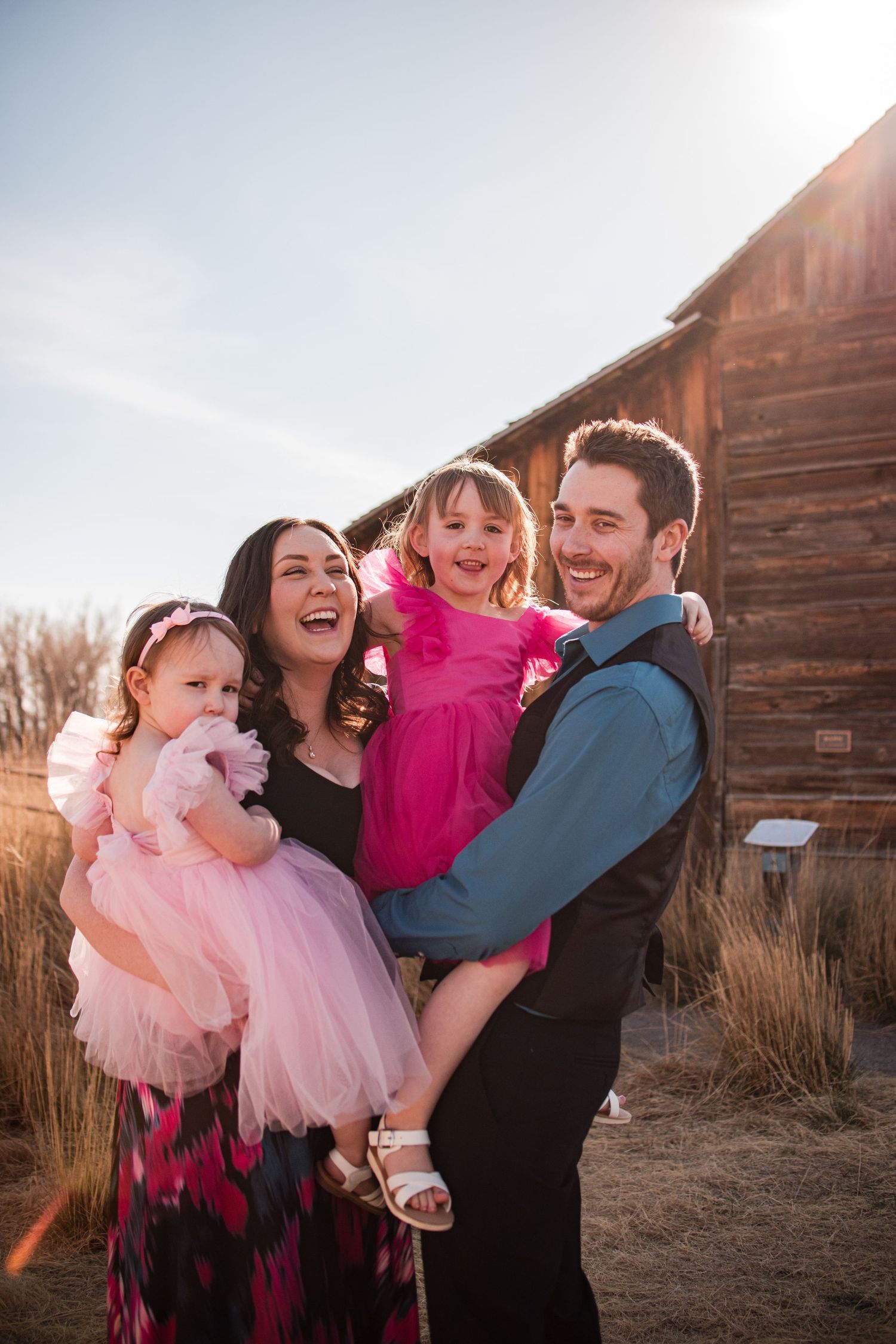 Longmont Family Session, outdoor near the rustic barn at Sandstone Ranch,  Bright and airy style, playful family candid fun moments local
