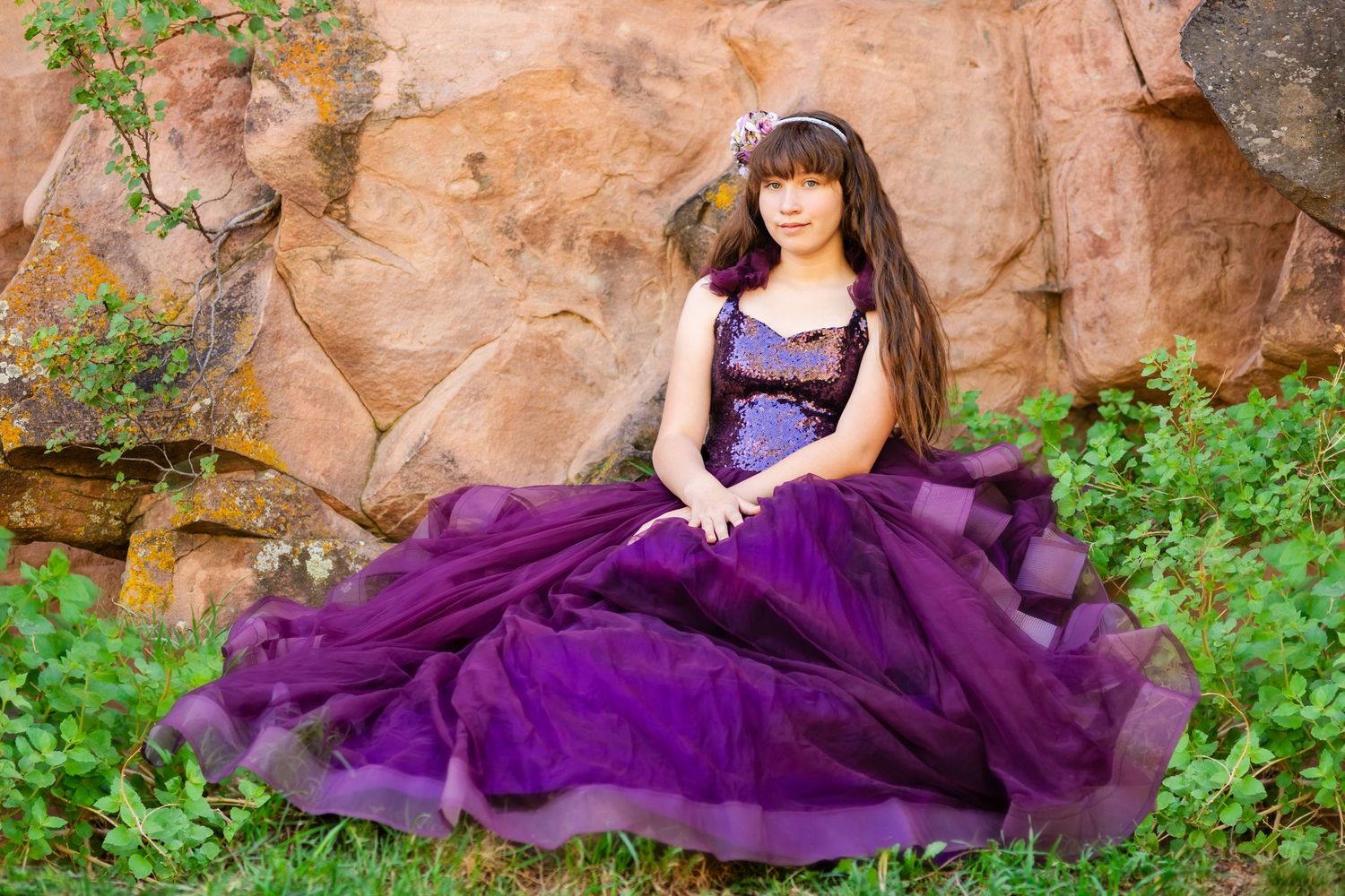 Little Dreamers Couture: the Abigail dress. Fine art portrait child session in Lyons, CO. Purple flowing gown, girl sitting near red rocks