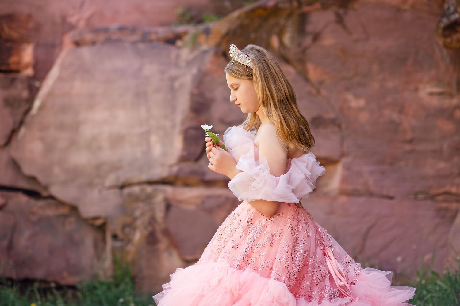 Little Dreamers Couture, the Jewel Gown & Crystal Crown Child  photo session wearing a pink dress holding a flower, location Lyons CO