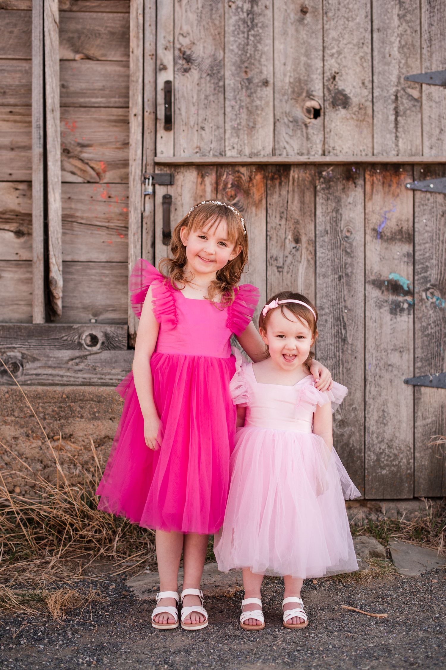 Longmont Family Photographer, outdoor near the rustic barn at Sandstone Ranch,  Bright and airy pink dress, siblings photoshoot