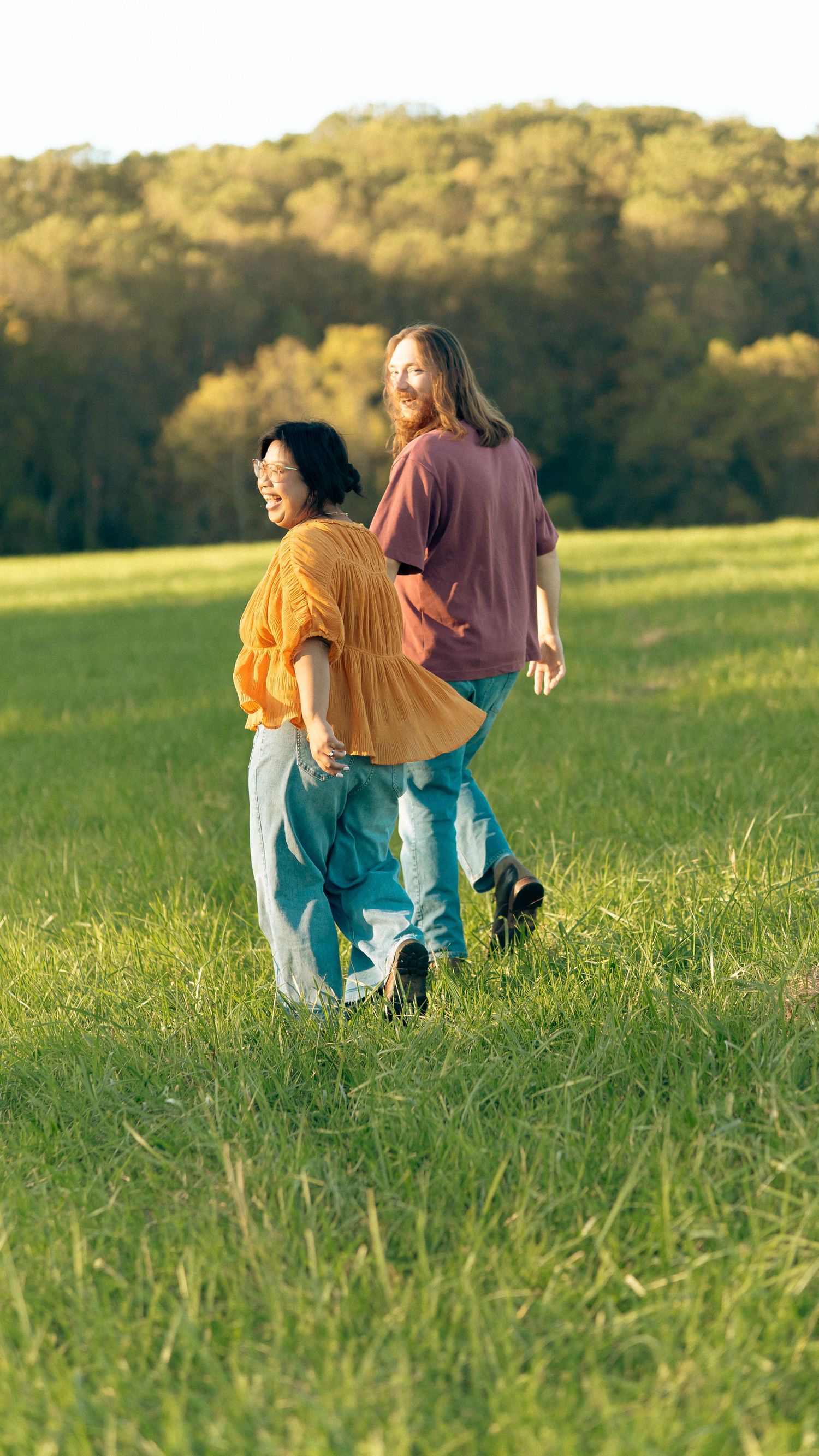 Couple Engagement photoshoot at Jerusalem Mill in Joppa Maryland. Couple looking back at photographer